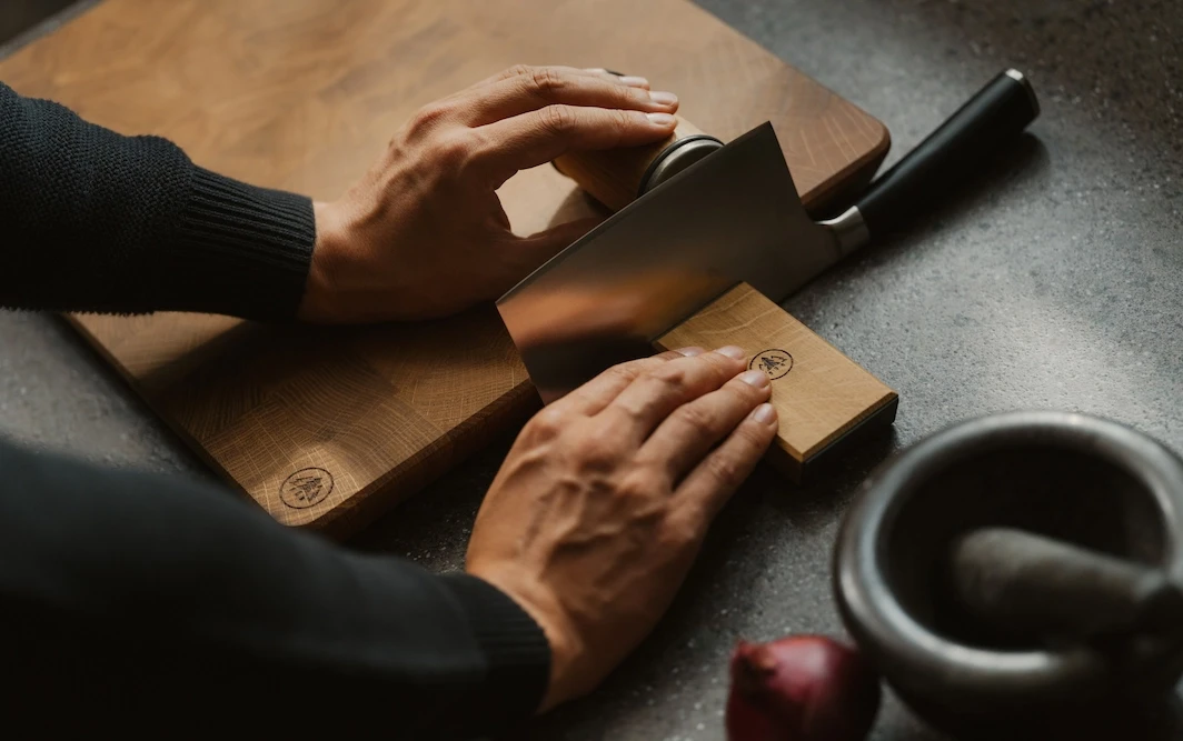 Wide-bladed knife sharpened with HORL3 by placing the roller on a cutting board for additional height.