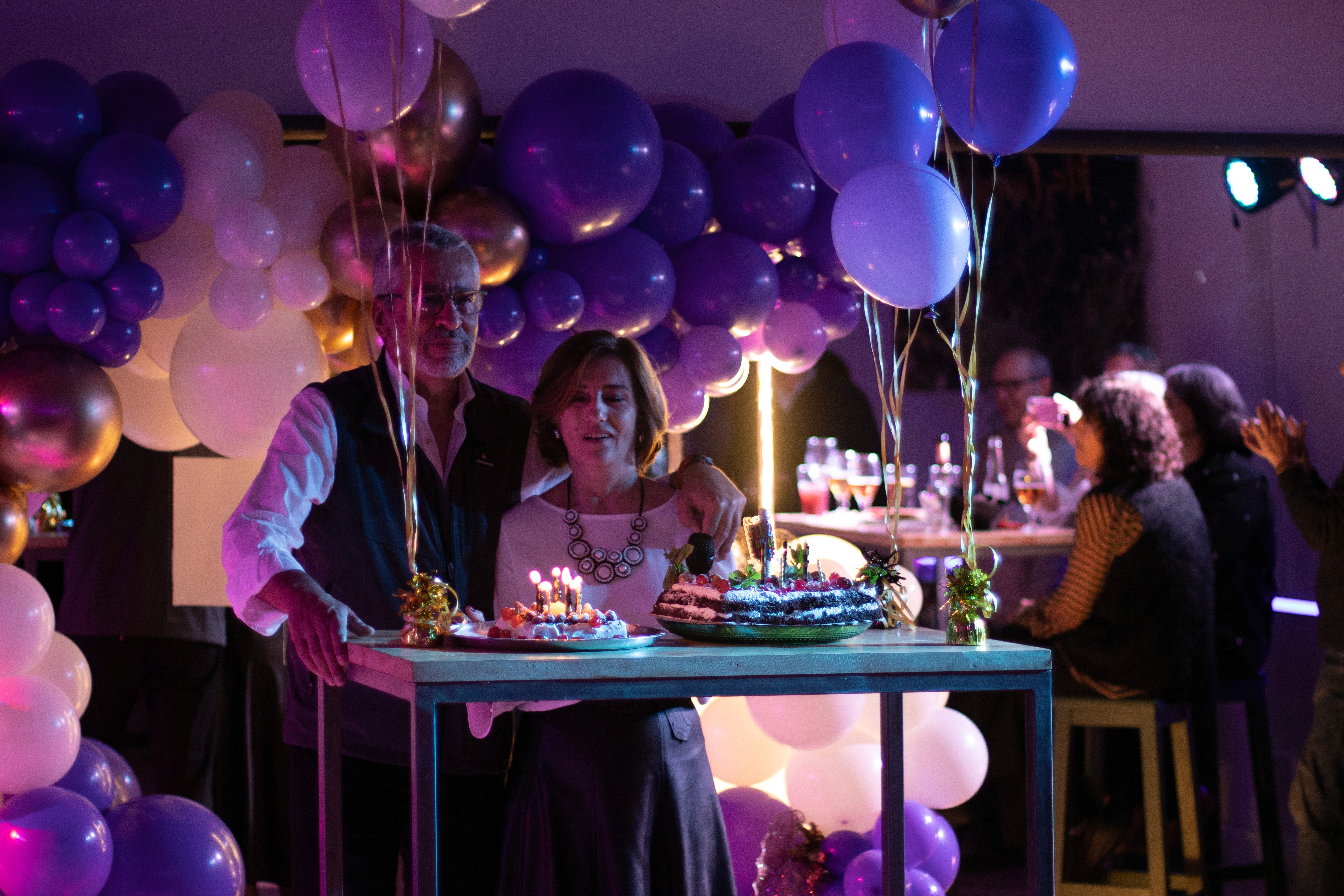 A light-filled fitness space with arched windows inside a coastal Mediterranean-modern villa, facing the ocean.