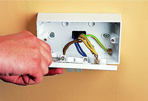 Electrical wiring and socket repositioning in a home.