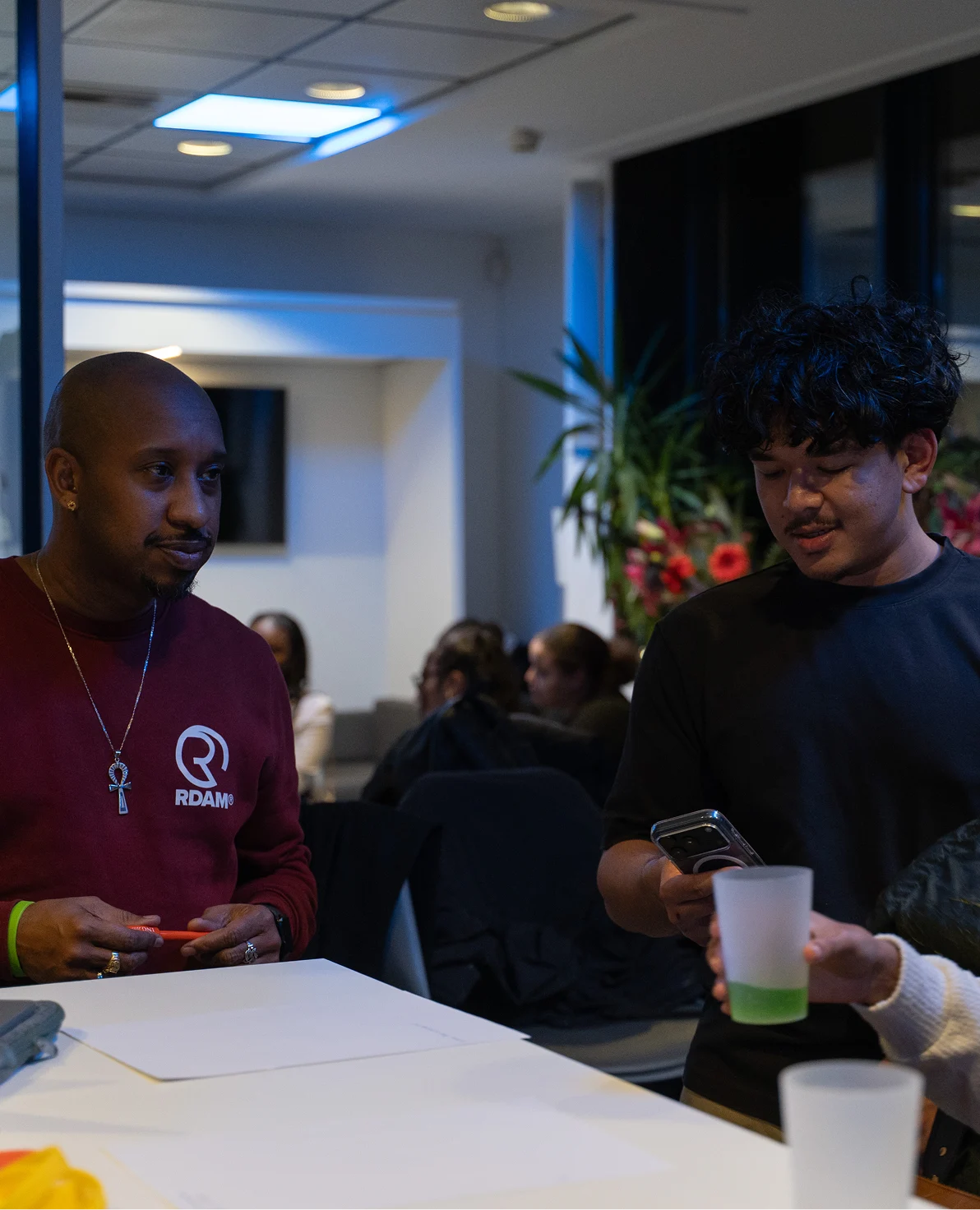 Randy Telg in conversation with a young person at a We Run Thiss event