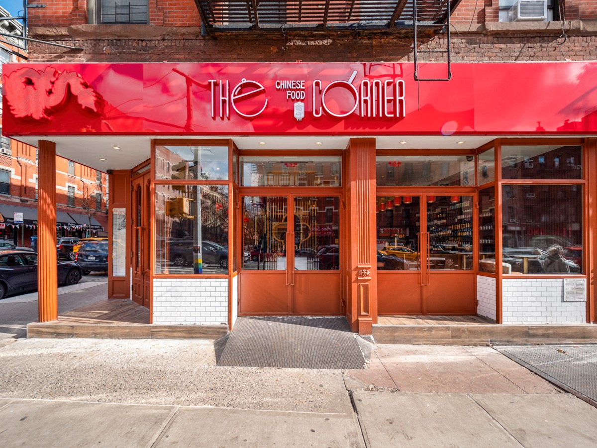 A street view of The Corner in Hell’s Kitchen, showcasing the modern signage and welcoming entrance of this Chinese-American restaurant.