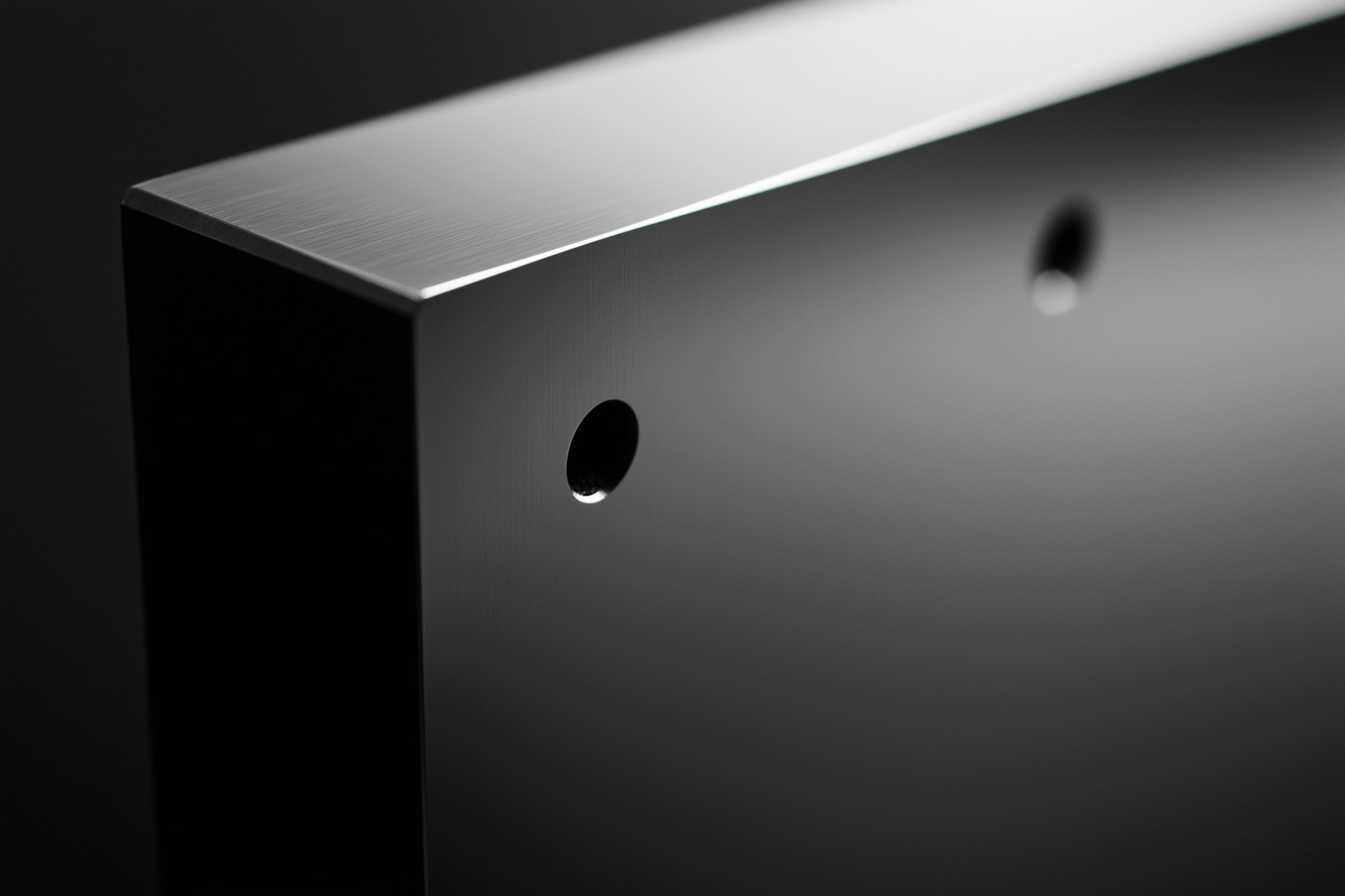 A black and white image showcasing a metal shelf, highlighting its structure and design in a minimalist style.