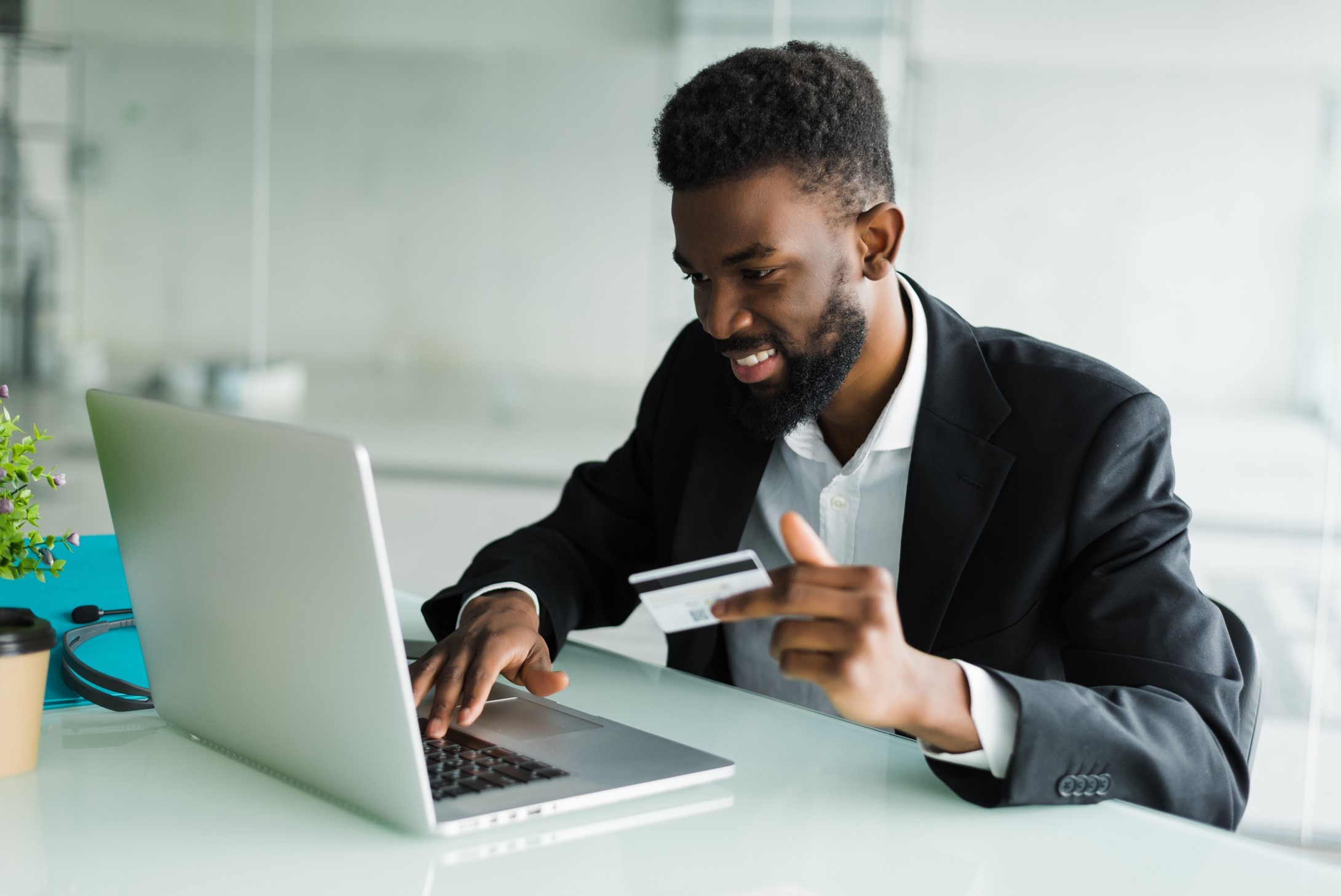 Man buying something oninle using bank card