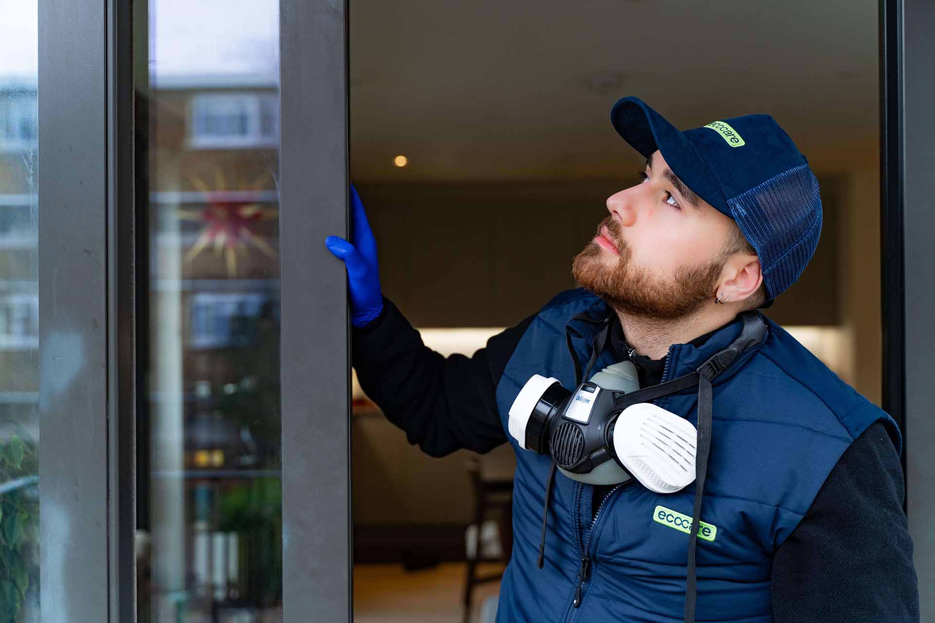 Pest control technician in residential apartment