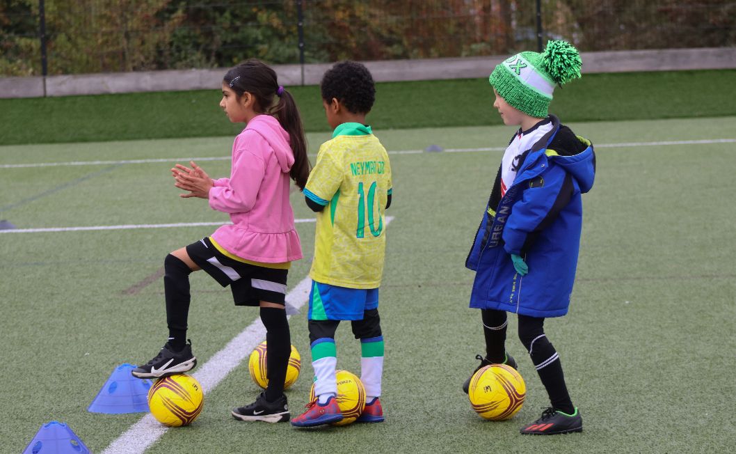 Kids sat around coach