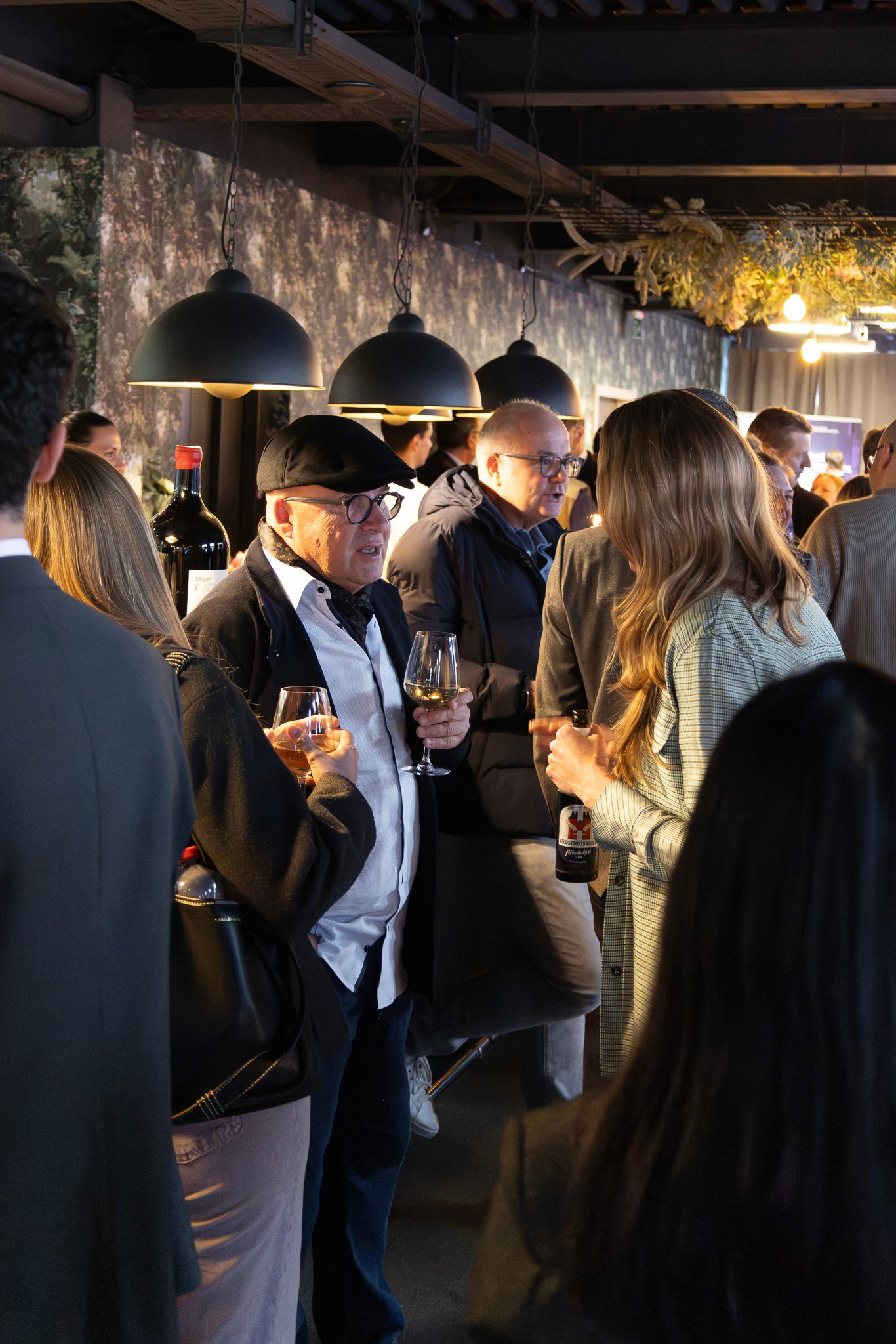 Guests networking during an evening reception at a blockchain conference in Zug.