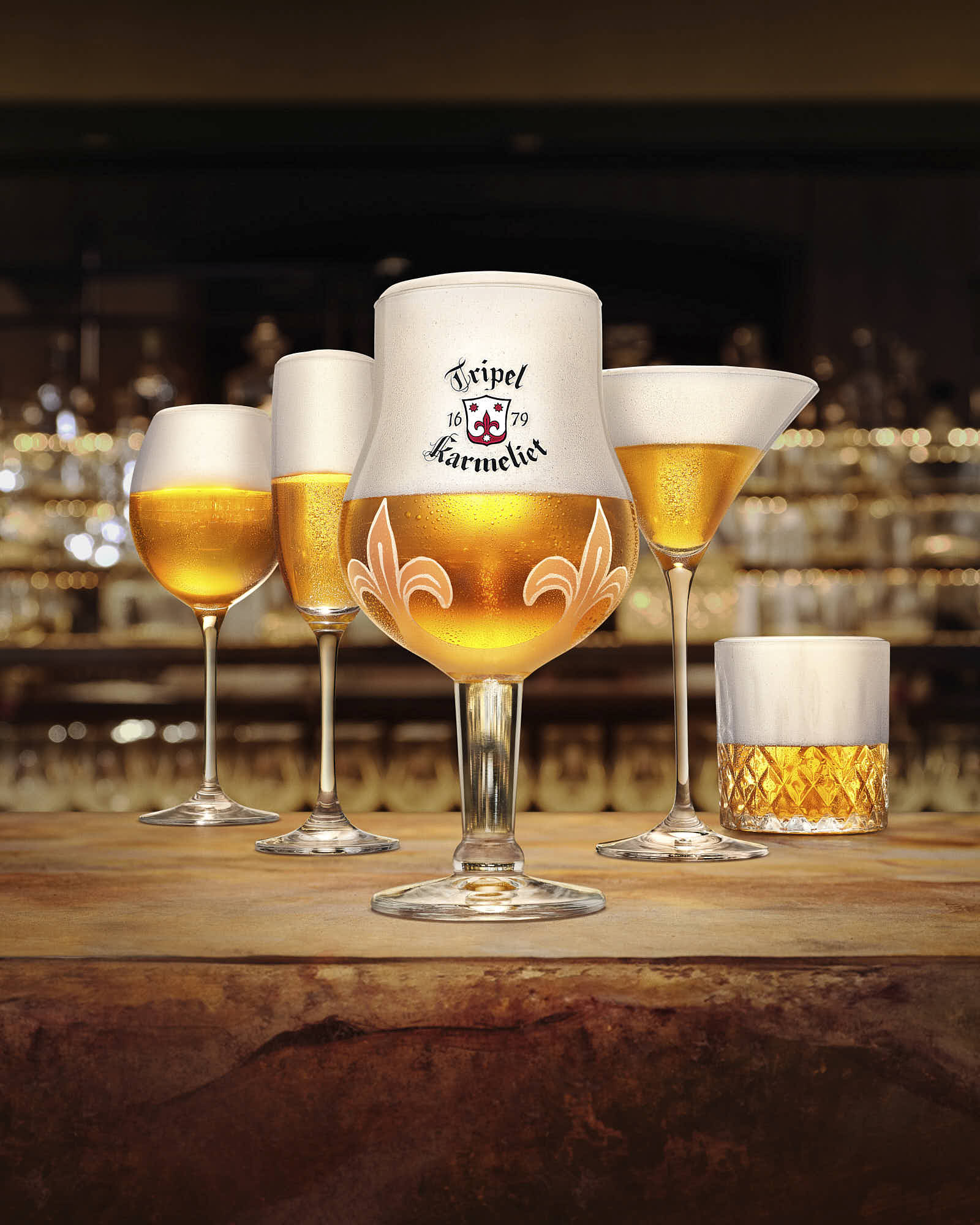 Several glasses of beer with frothy tops are arranged on a wooden surface, creating a warm, inviting atmosphere.