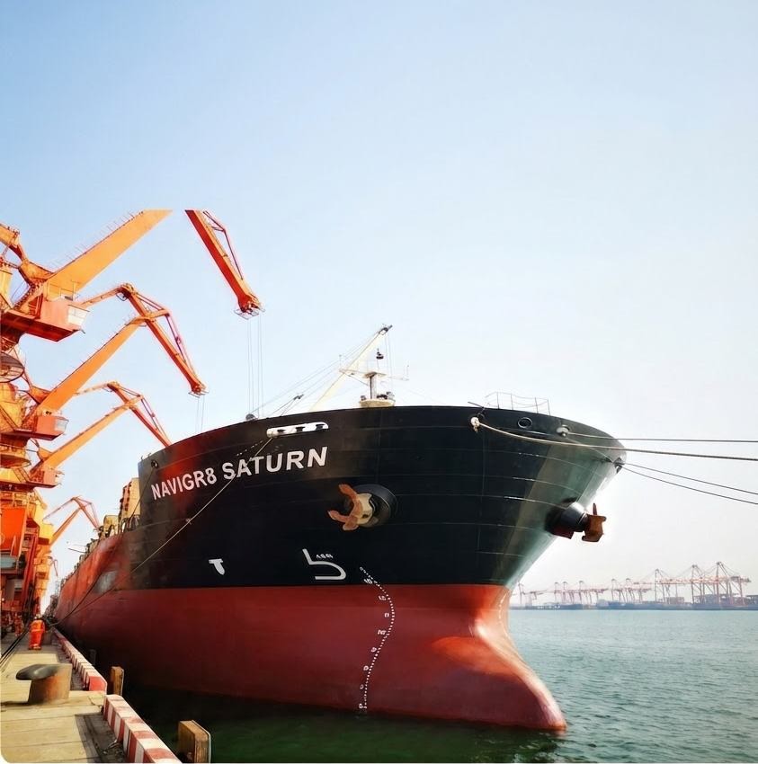 The bulk carrier NAVIGR8 SATURN alongside at berth, with port cranes in the background