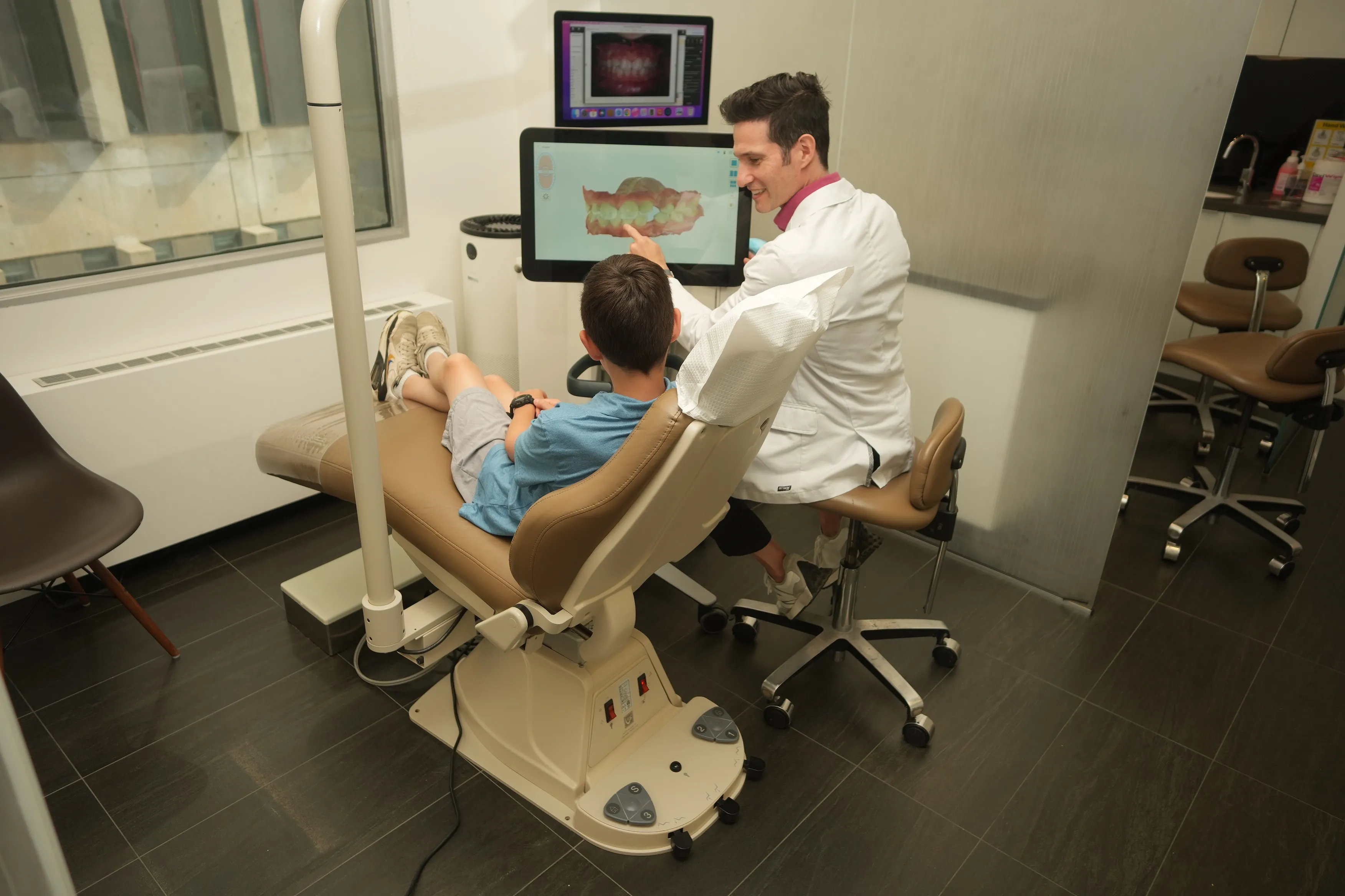 Dr. Bradley Lands Explaining Teeth Alignment Process at Midtown Orthodontics | Best Orthodontist in Midtown Toronto, ON