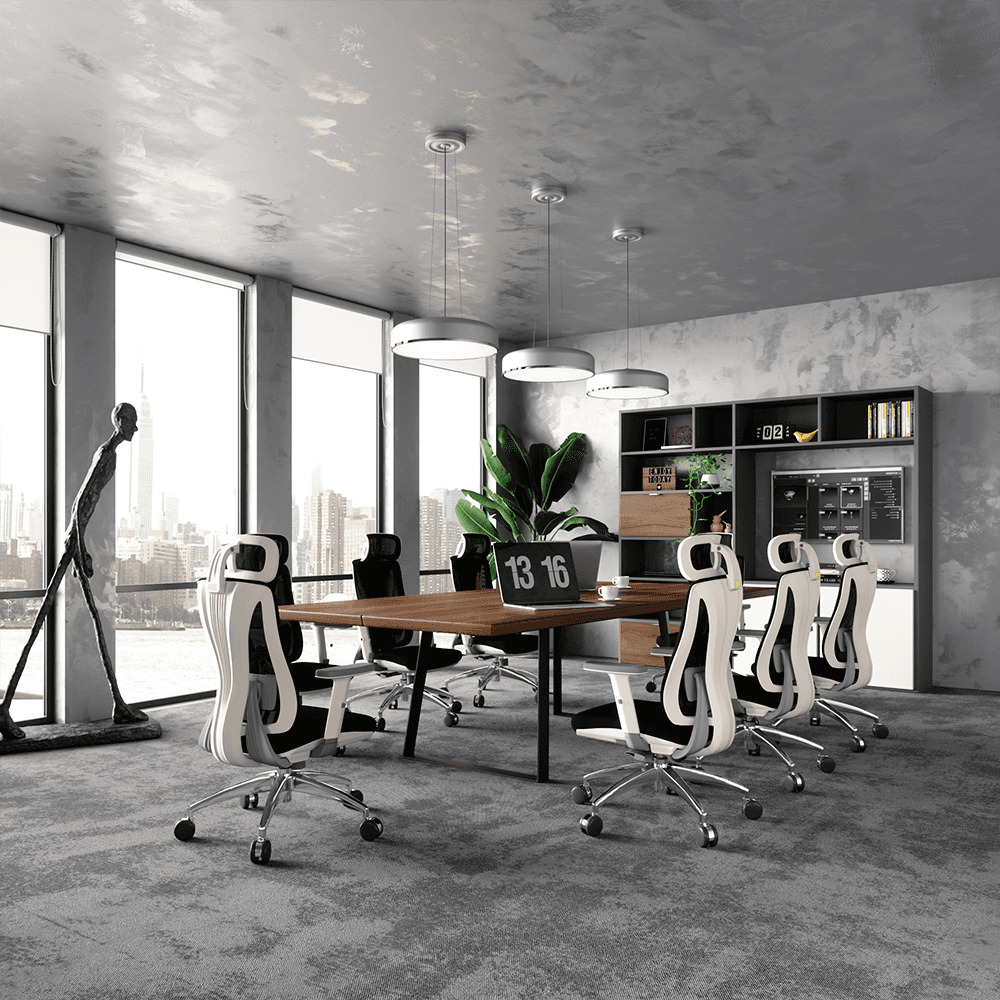 A long, dark wood conference table is centered in the room, surrounded by several high-back ergonomic office chairs in a striking white and black two-tone design with silver chrome bases