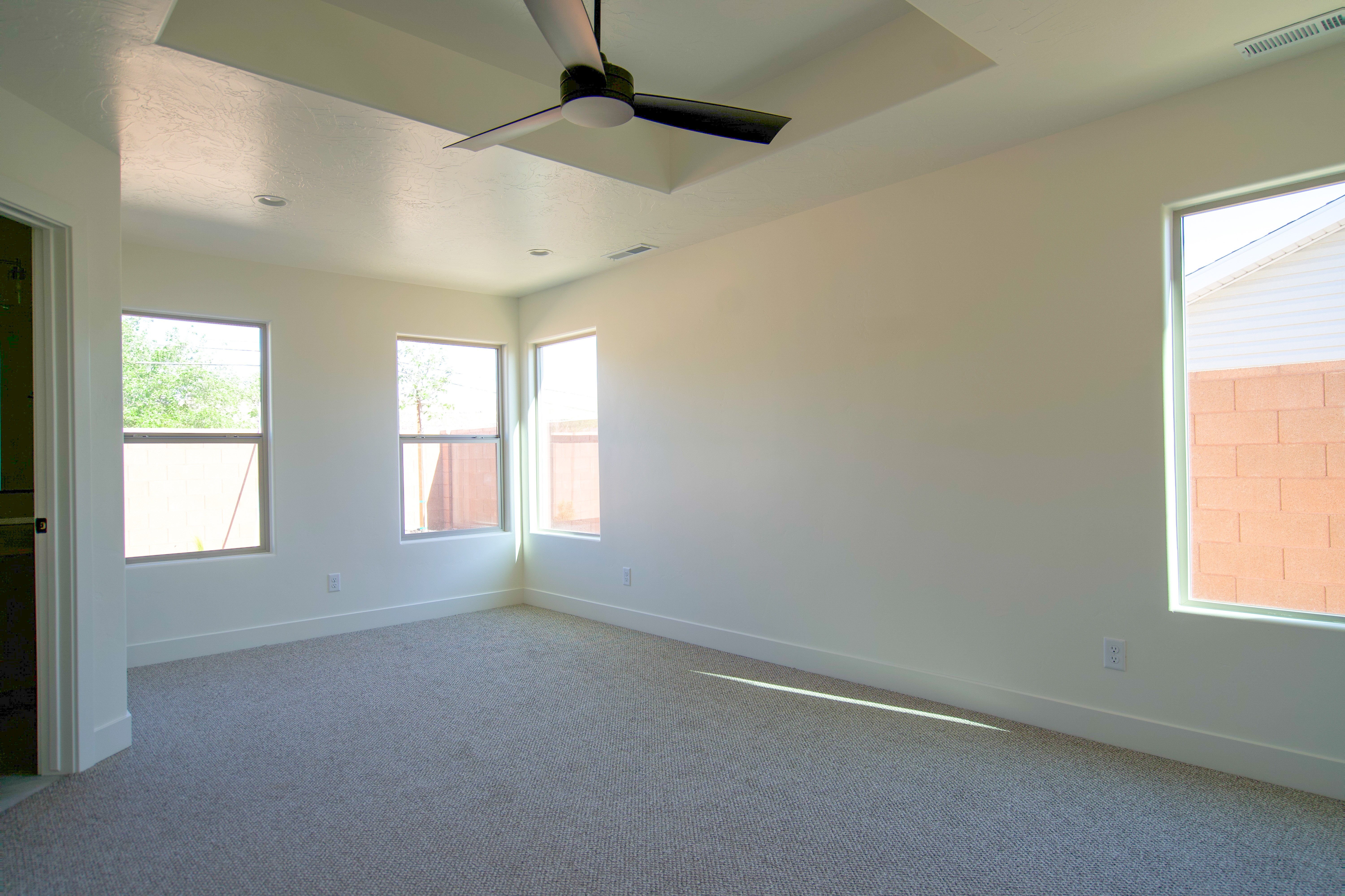 Bedroom in a Hurricane, Utah remodel with light finishes and natural light.