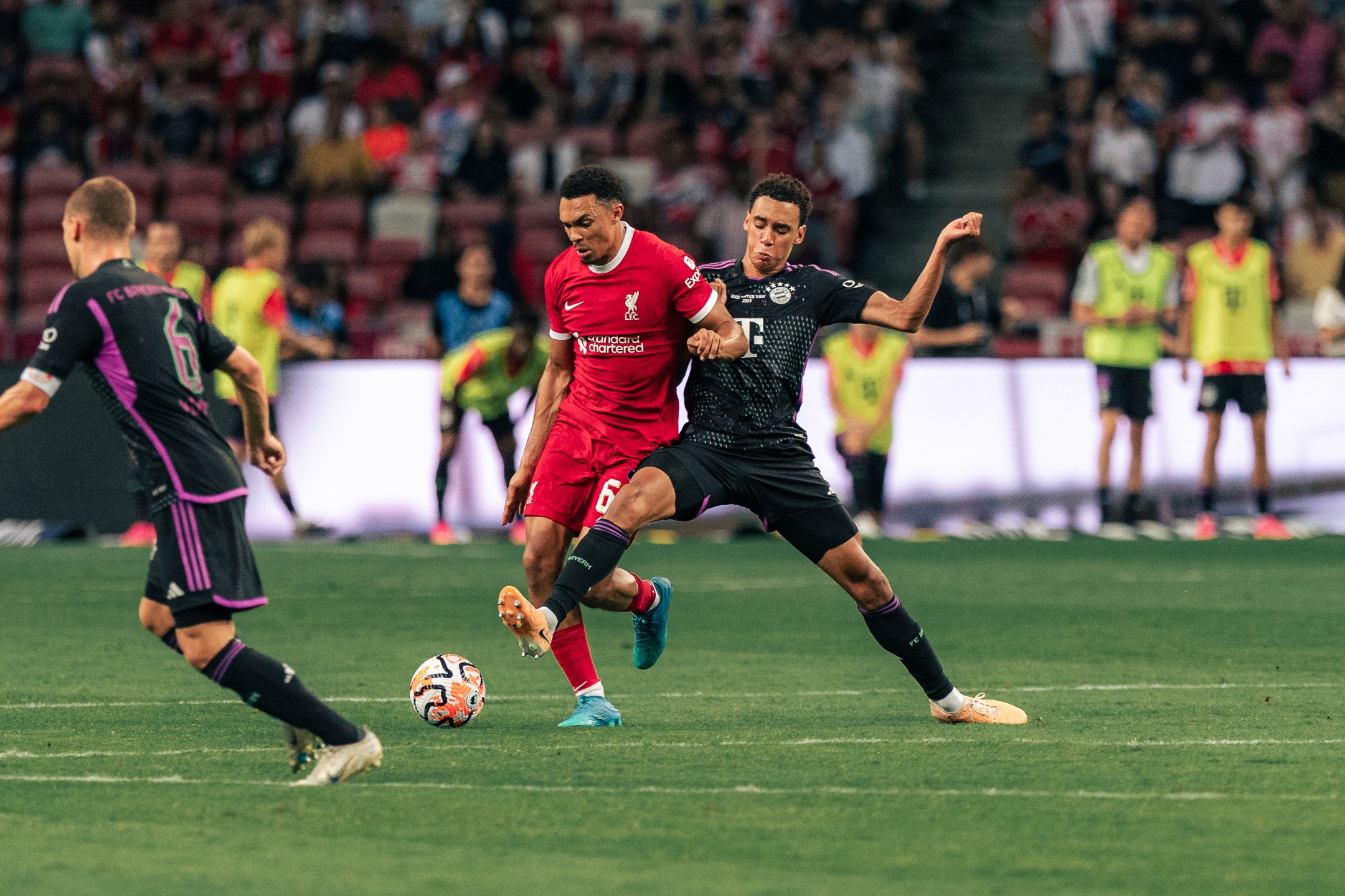 Jamal Musiala of Bayern Munich tackling Trent Alexander-Arnold of Liverpool at the Singapore Festival of Football 2023, photographed by Edmund Wong