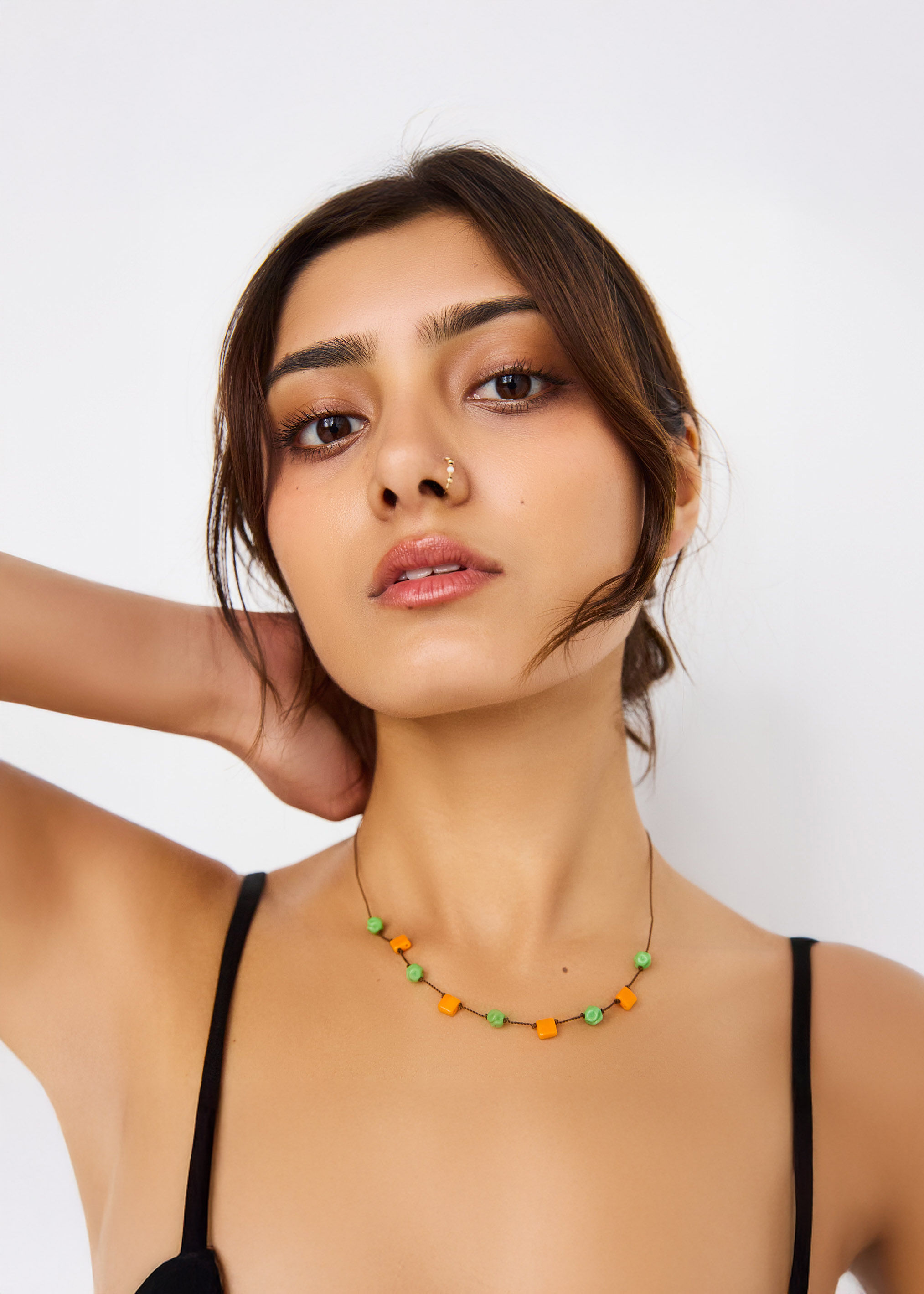 Woman walking on a curved pavement with shadow.