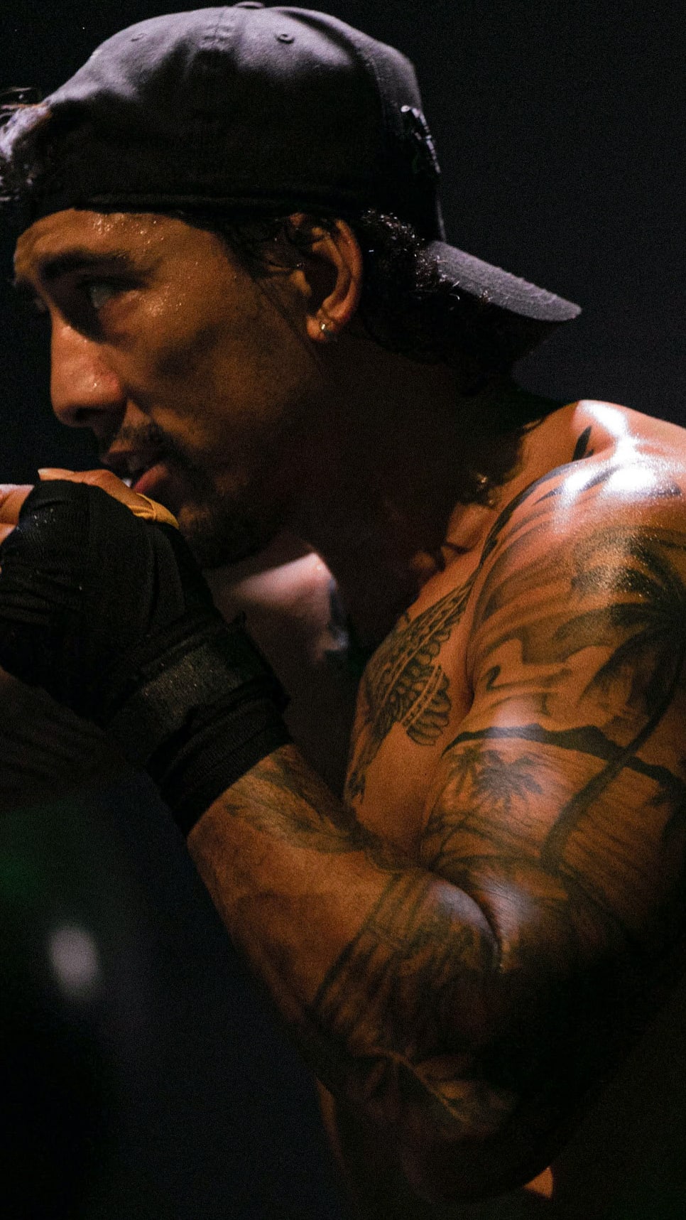 Black cosmetic product bottle against a dark background