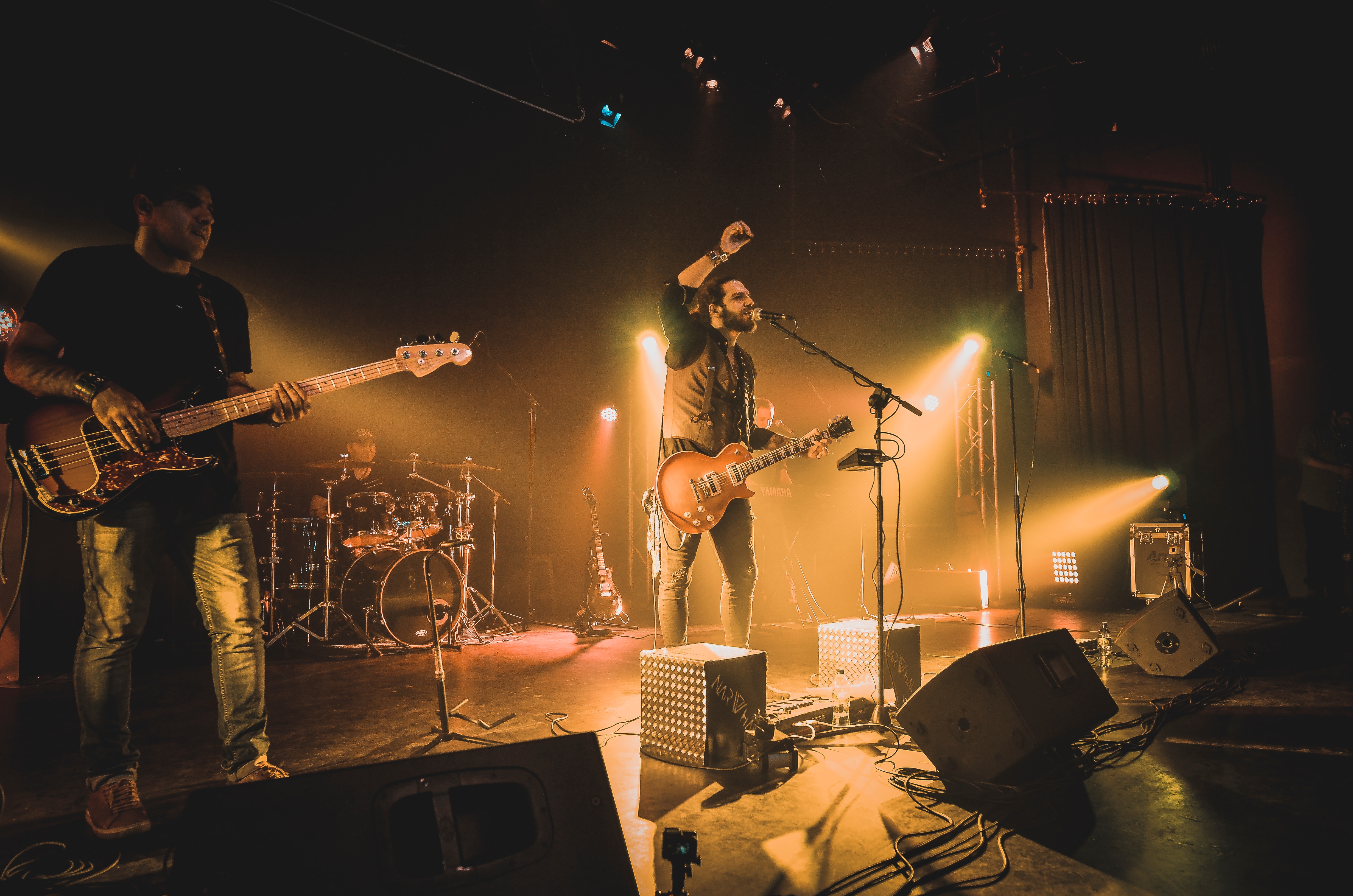 Singer with his band performing - hire a singer