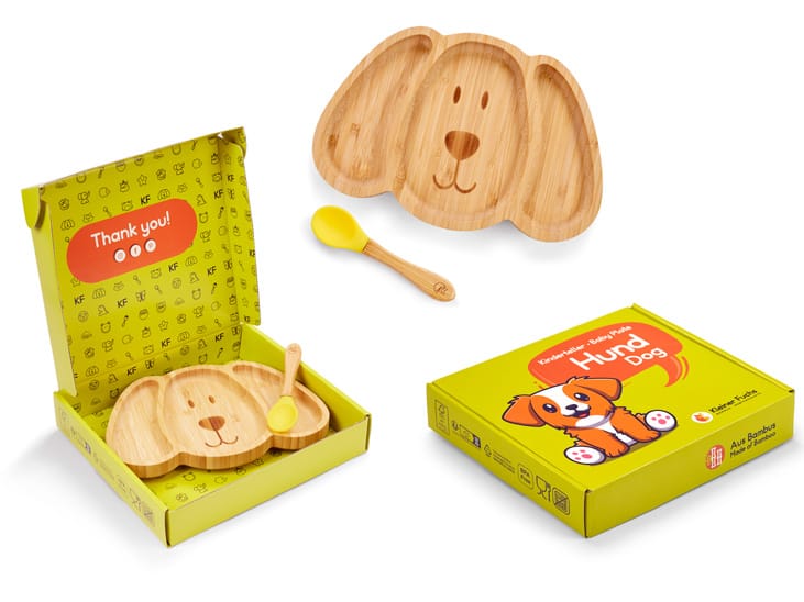 Bambusowy talerzyk dla dzieci w kształcie pieska z łyżeczką i ekologicznym opakowaniem, packshot produktowy
