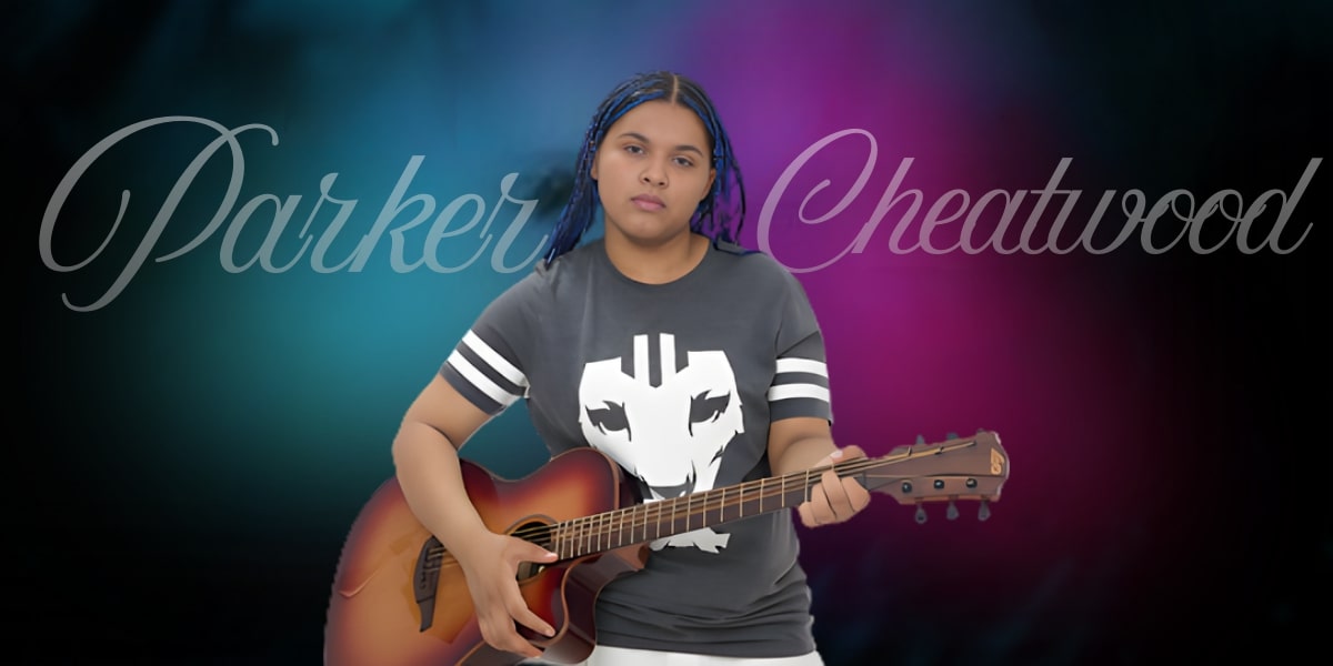 Parker Cheatwood, a young multi-talented performer, holds a guitar, exuding confidence and charisma in front of colorful lights.