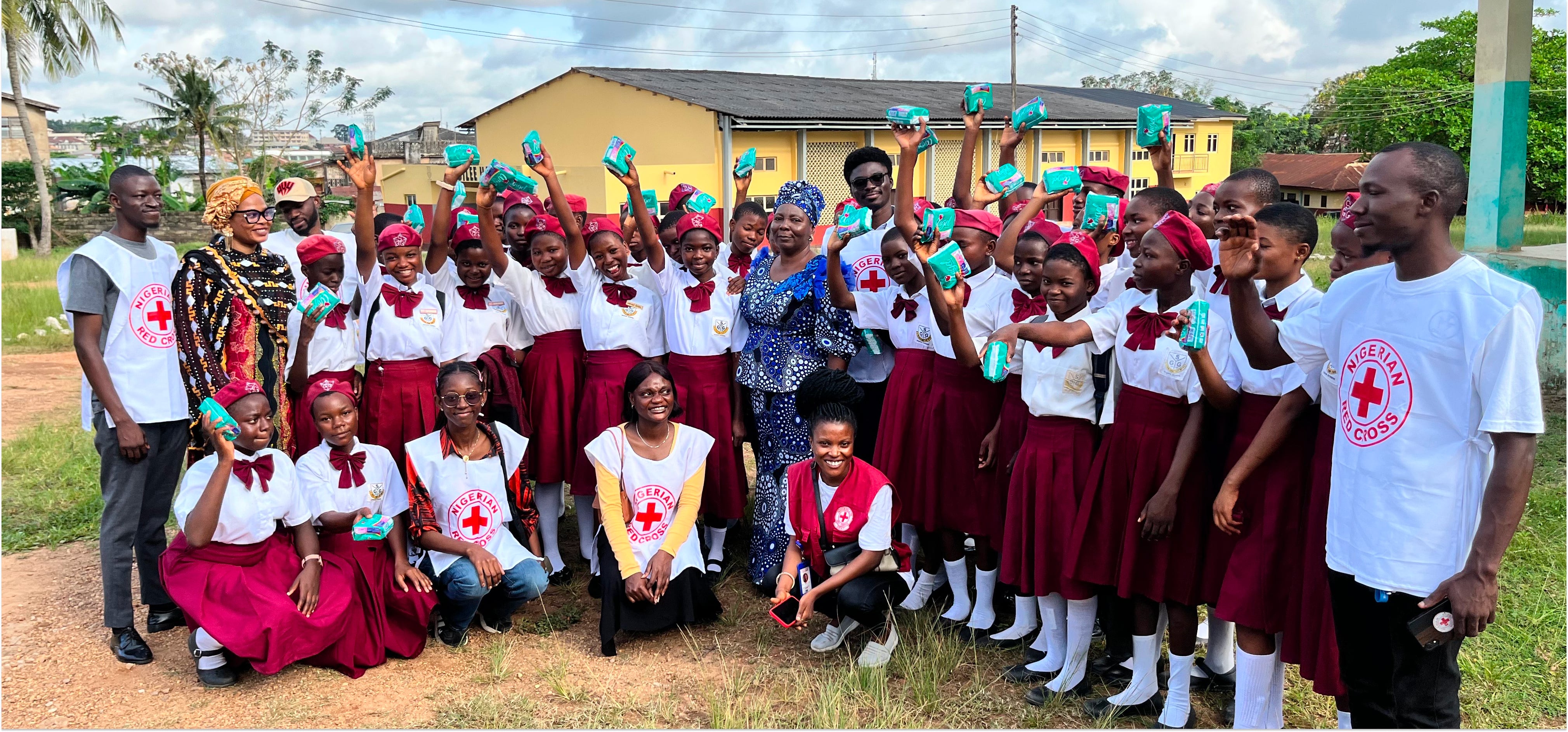 Precious sharing sanitary pads with a group of younger students