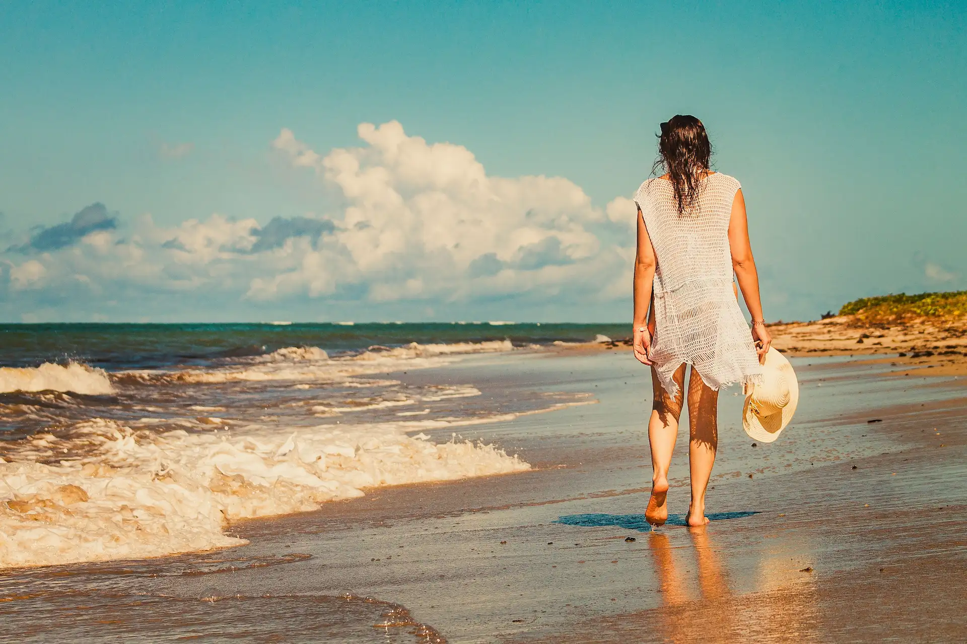person walking on the beach