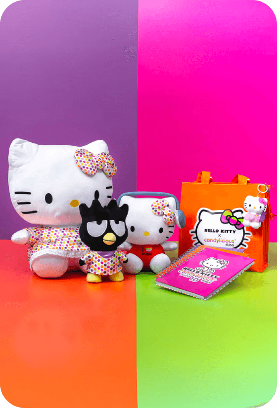 Full moon rising over a dark, silhouetted mountain ridge.