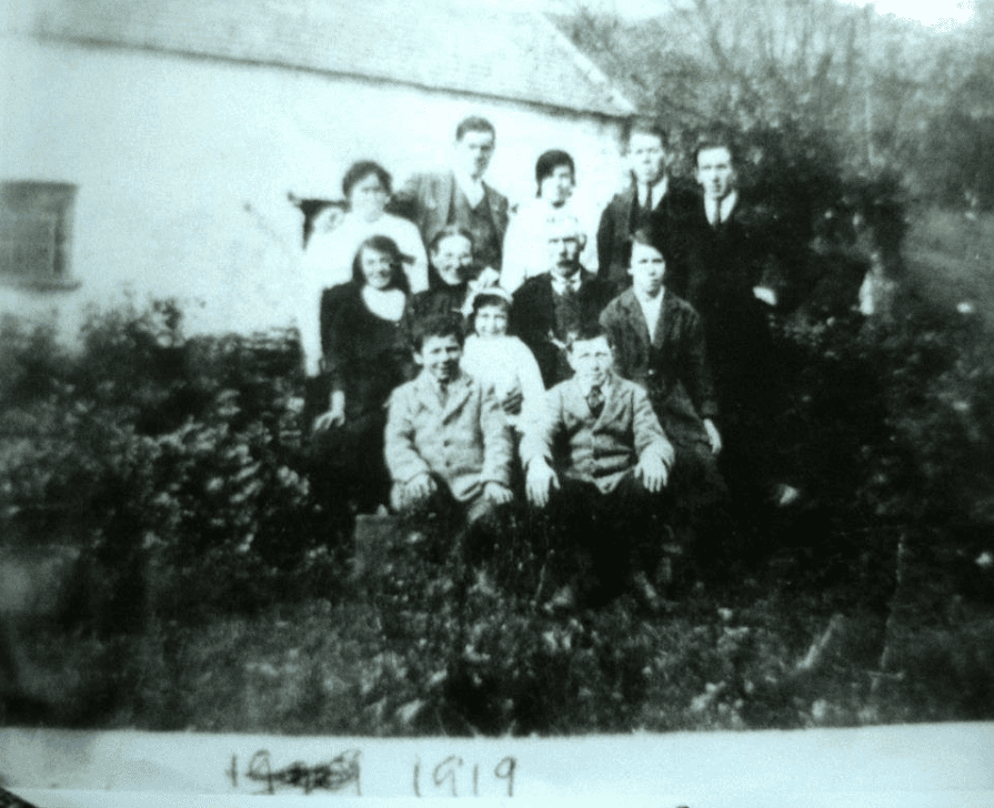 Old photo of the Downing family infront of the Strawberyfield in 1919