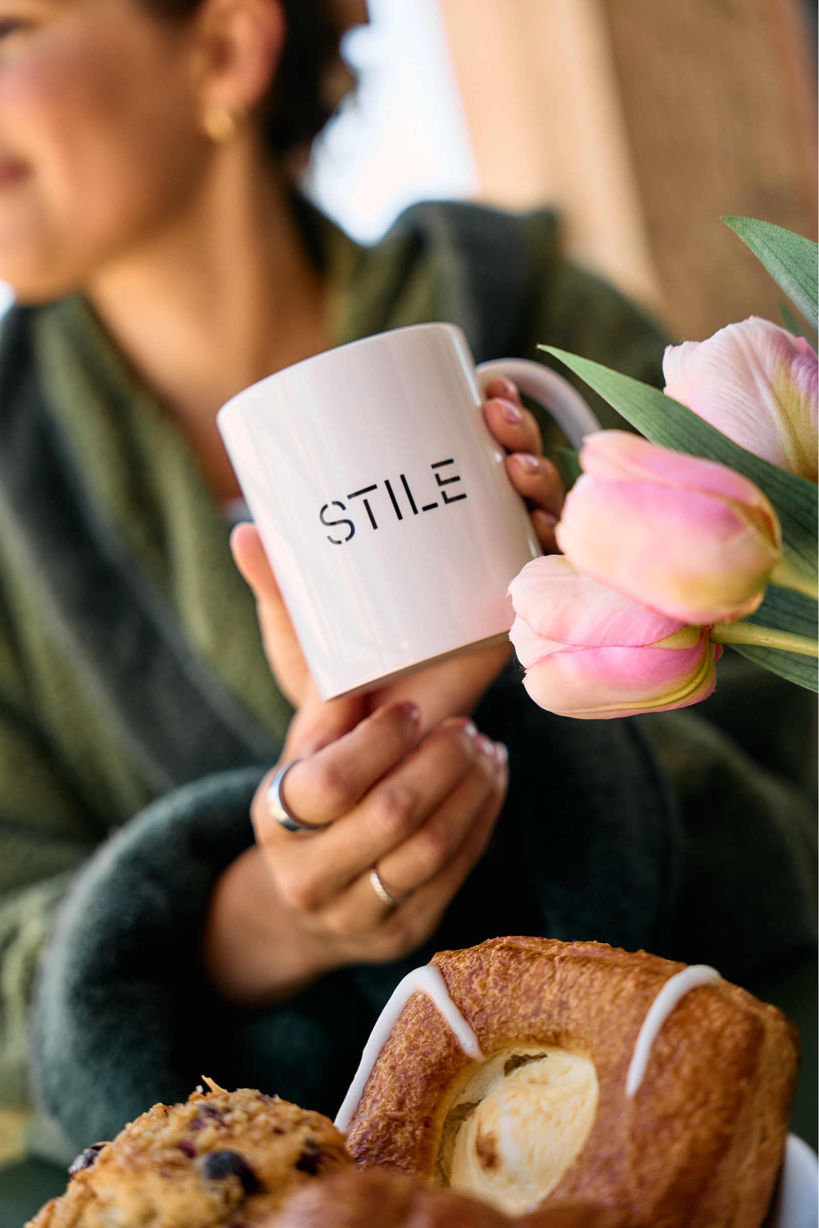 STILE coffee mug and pastries