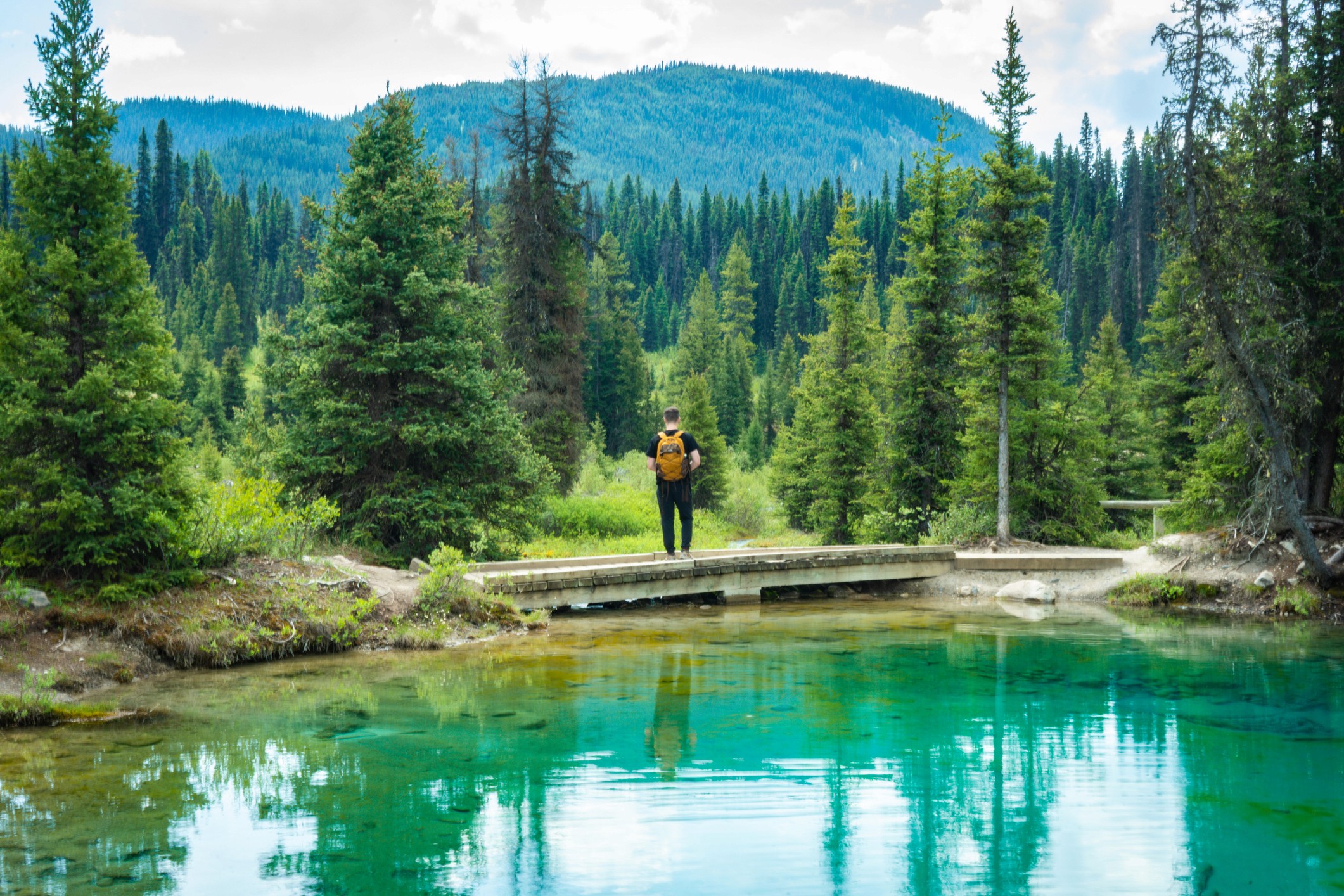 person making a contactless payment with a card