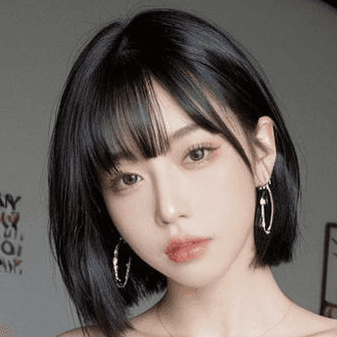 a young man wearing a hat and a t - shirt