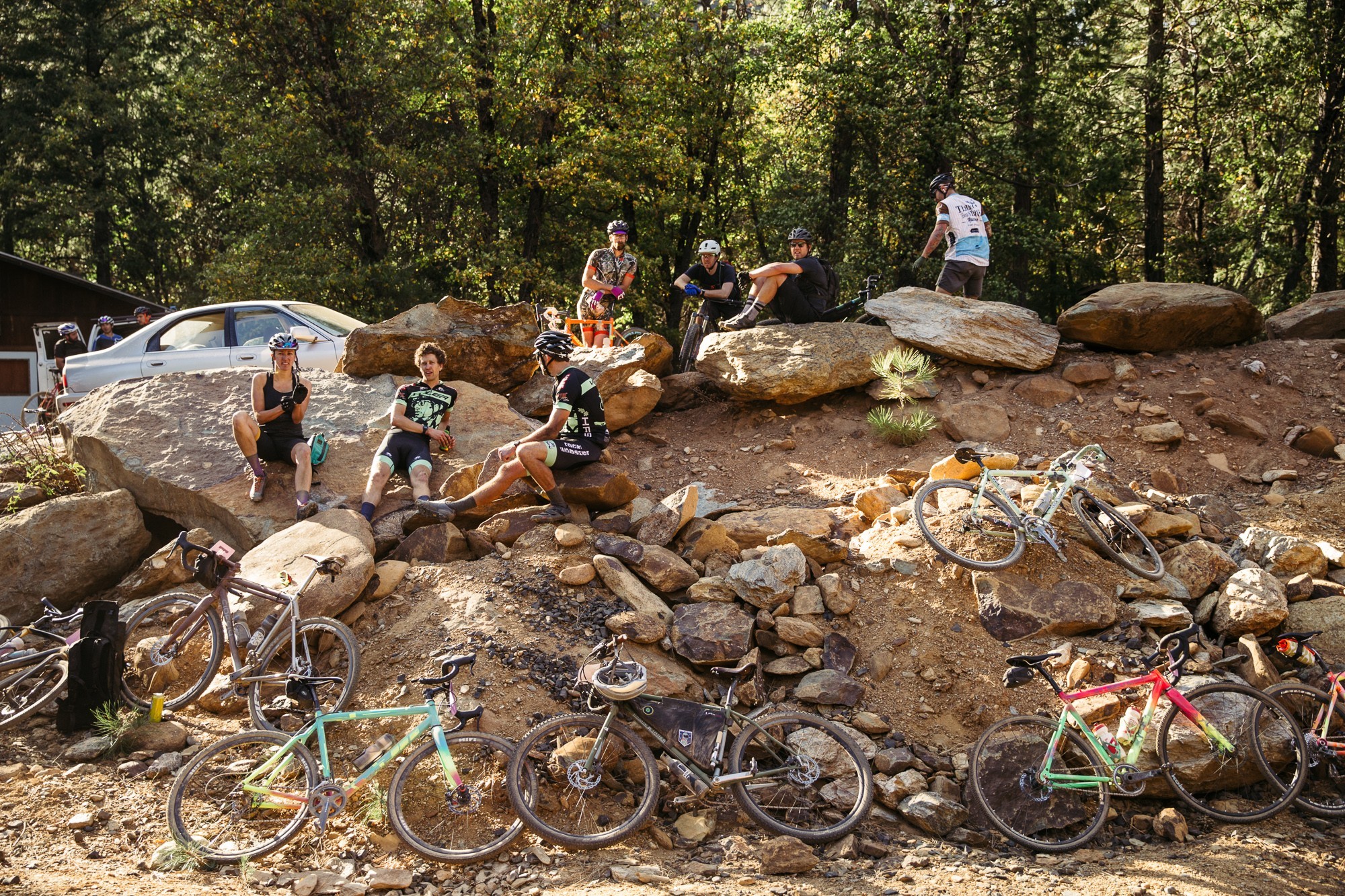 Cyclists resting next to their bikes