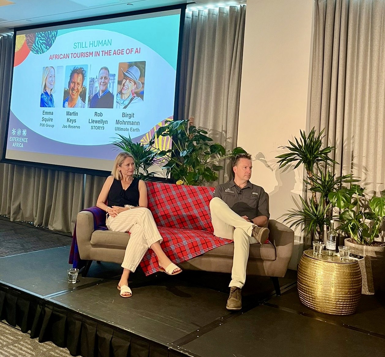 Emma Squire at a speaking event with a guest