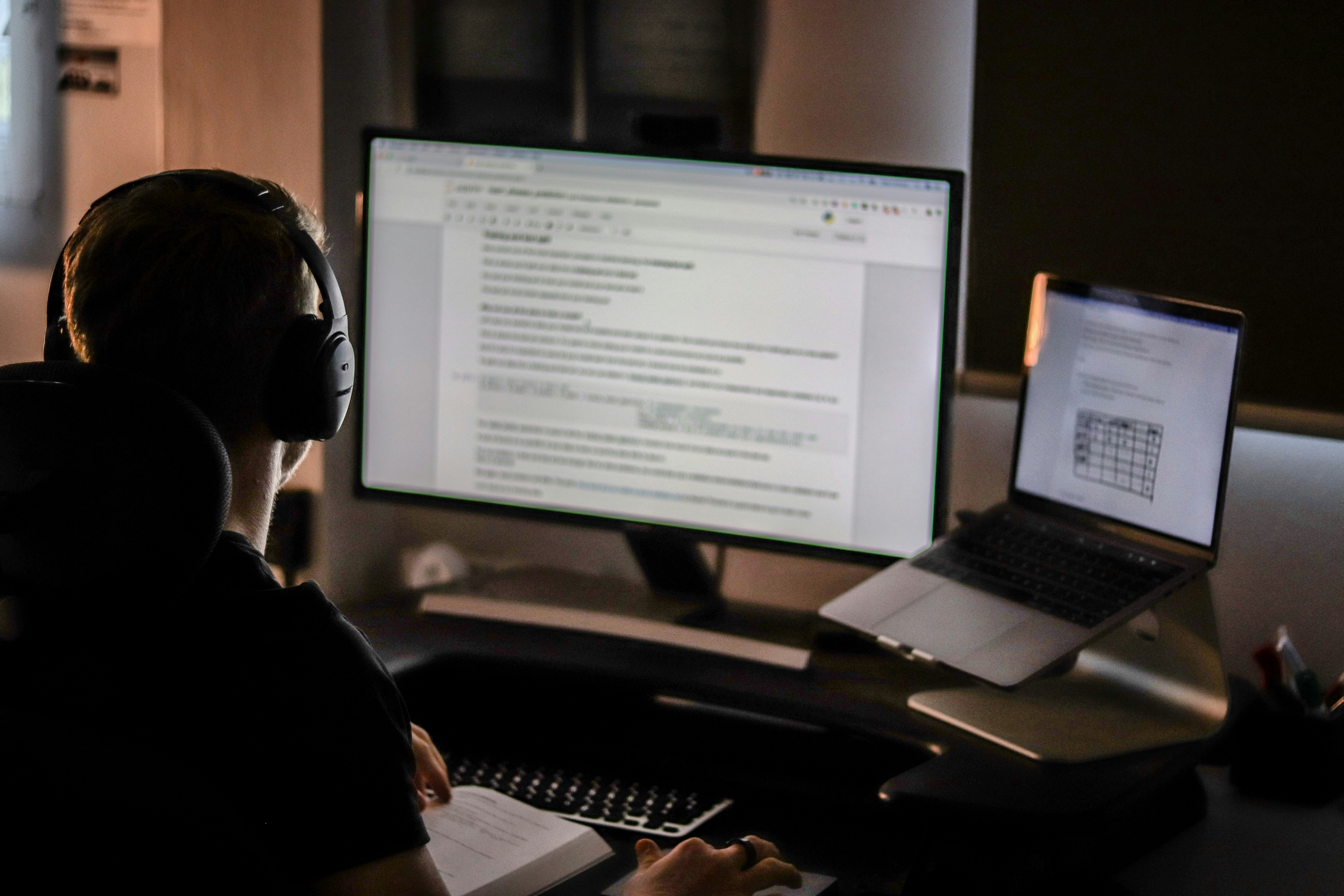 person on computer studying Surgery Shelf Exam