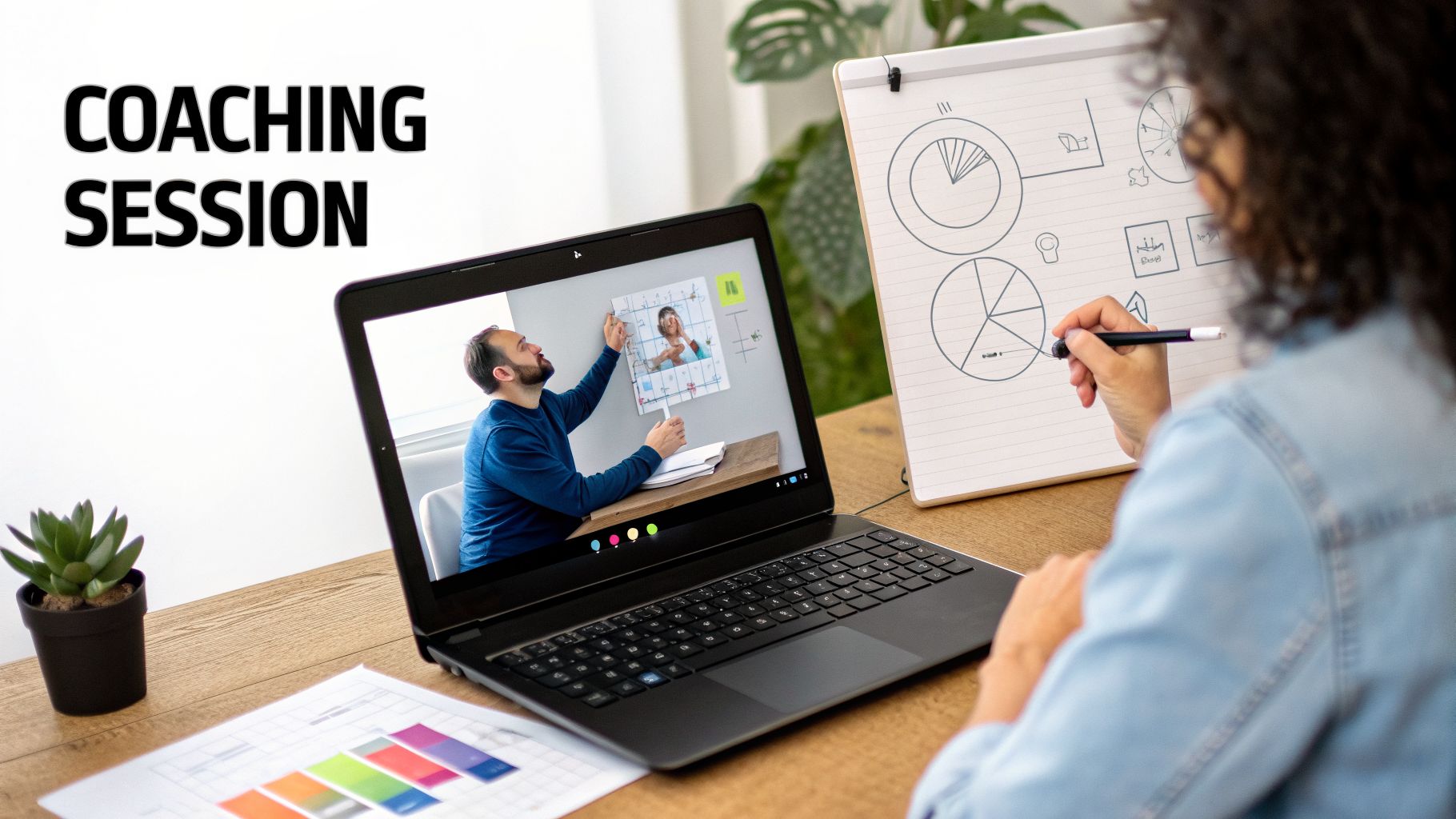 A person engages in a virtual coaching session on a laptop, drawing on a whiteboard with charts.
