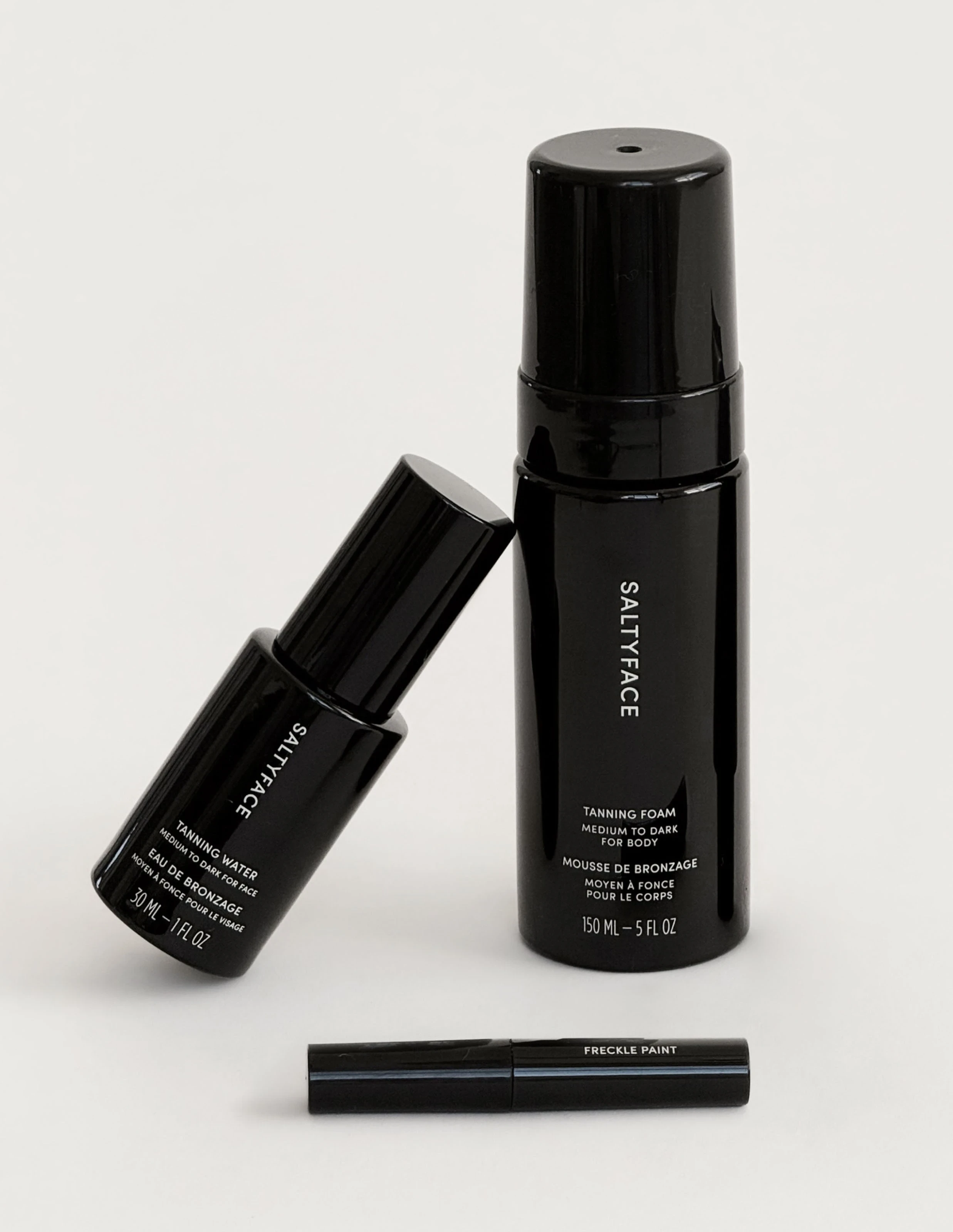 Saltyface skincare products featuring the brand's visual identity