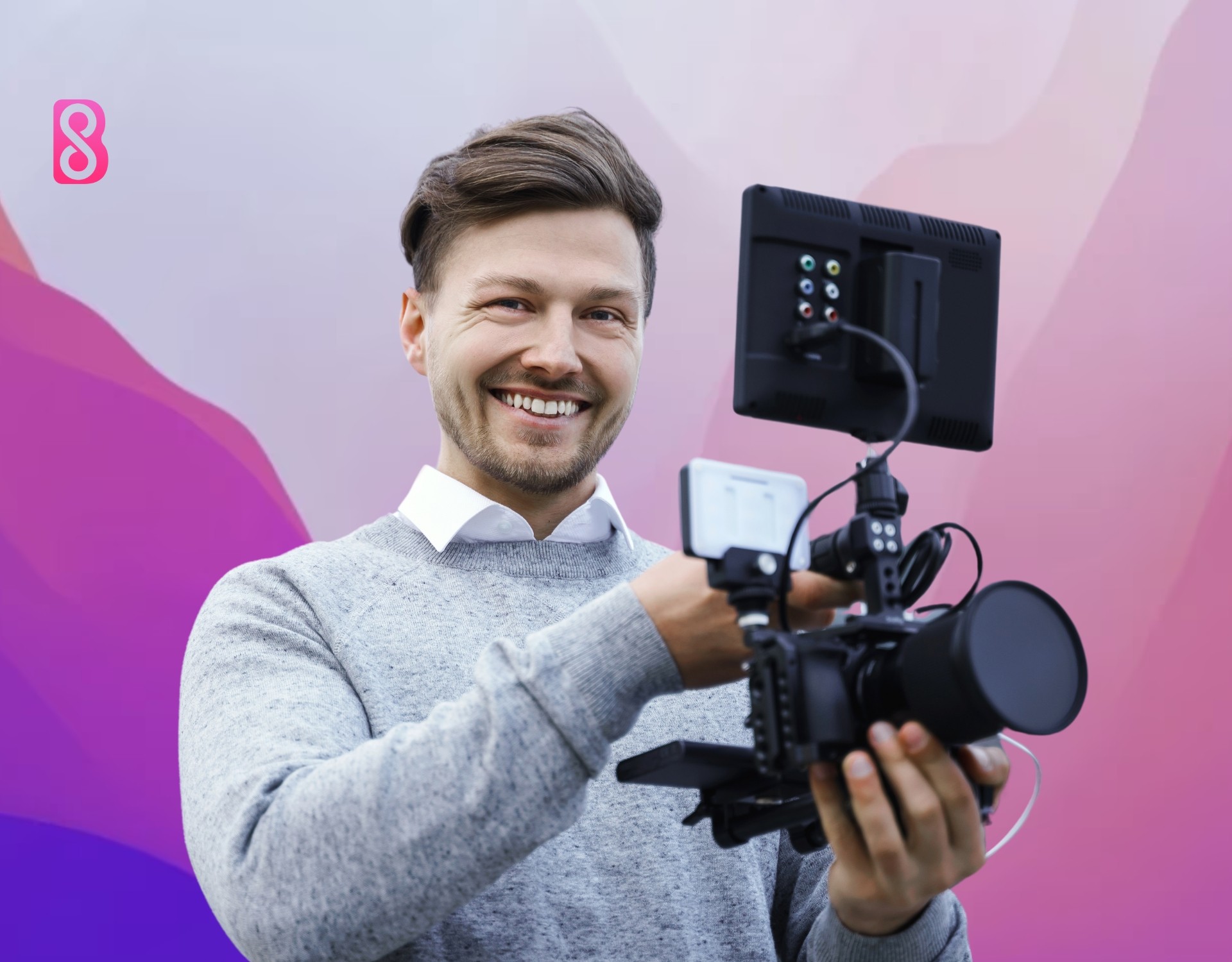 A man who is a photographer holding his camera