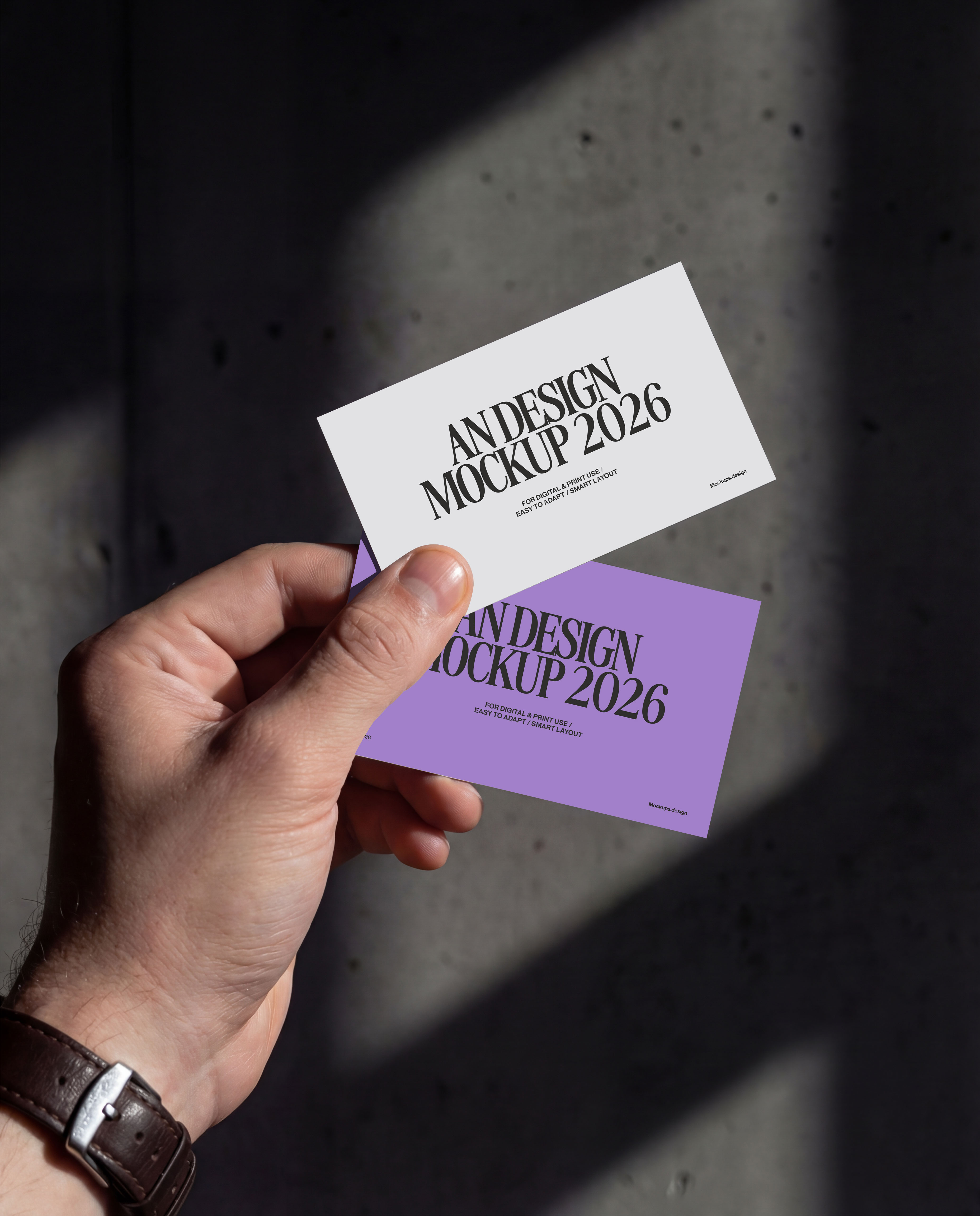 Hand holding business card mockup, realistic presentation