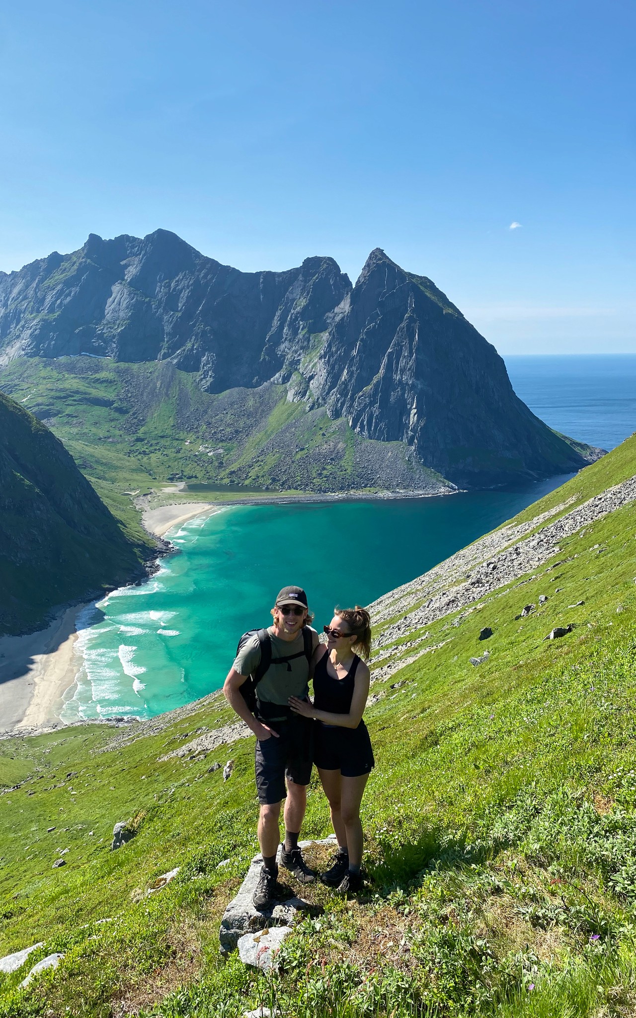 Lukas and his girlgriend in norway, a stunning view over mountains and the ocean