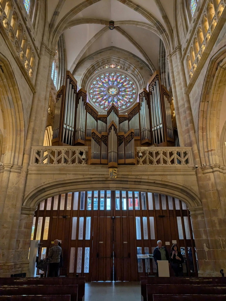 Pipe organ and stained-glass rose window inside Bayonne Cathedral