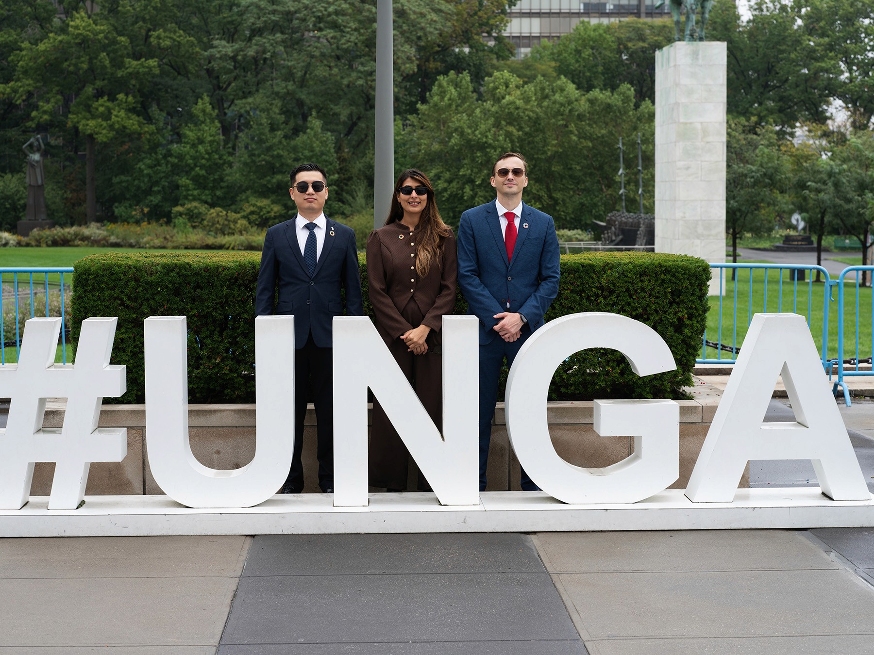 Faces of Impact Founder Artem Shestakov, FOI President Priyanka Chahal, and Yulin Wang at UNGA 80 at UN Headquarters.