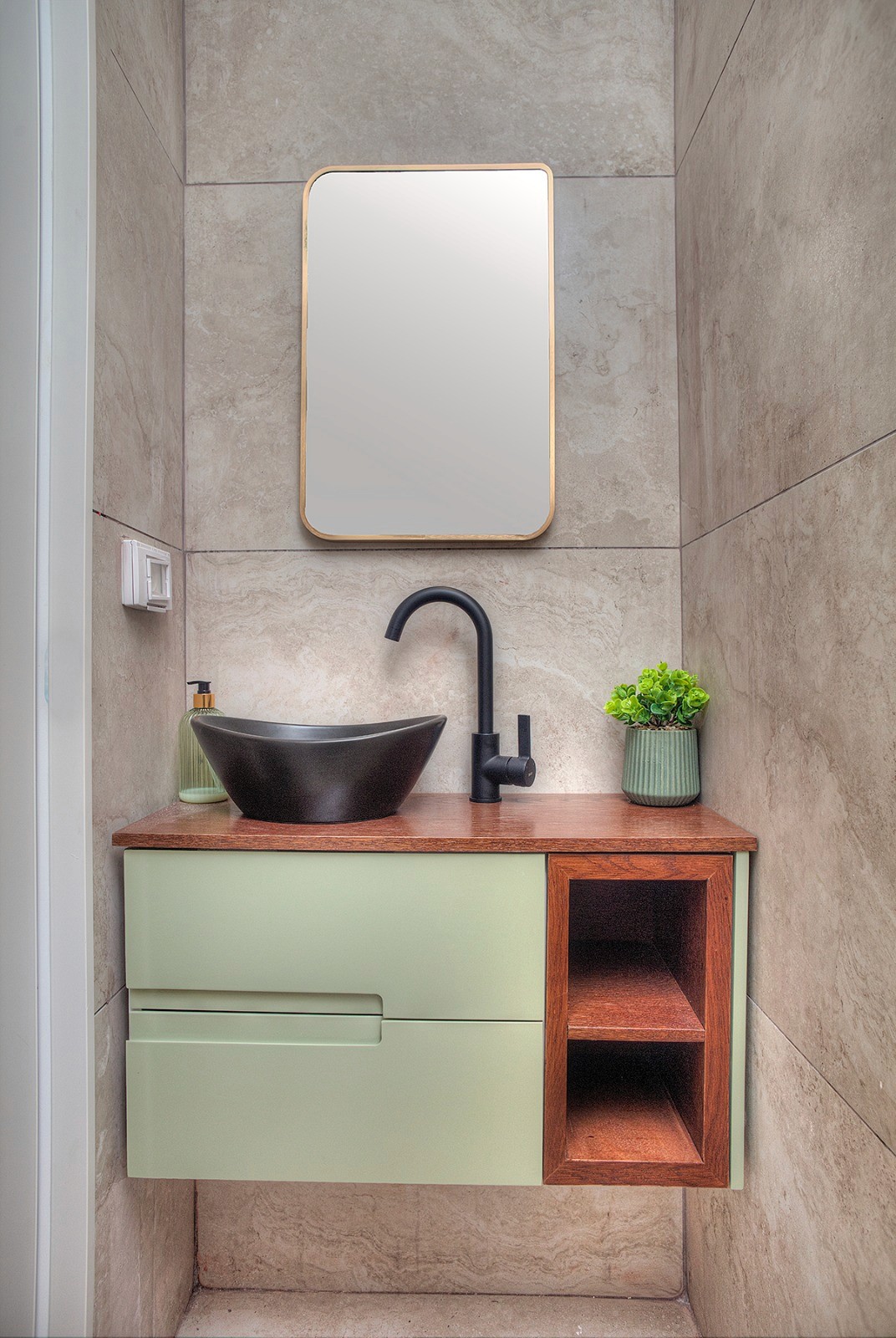 Soft pink tulips bloom in a field.