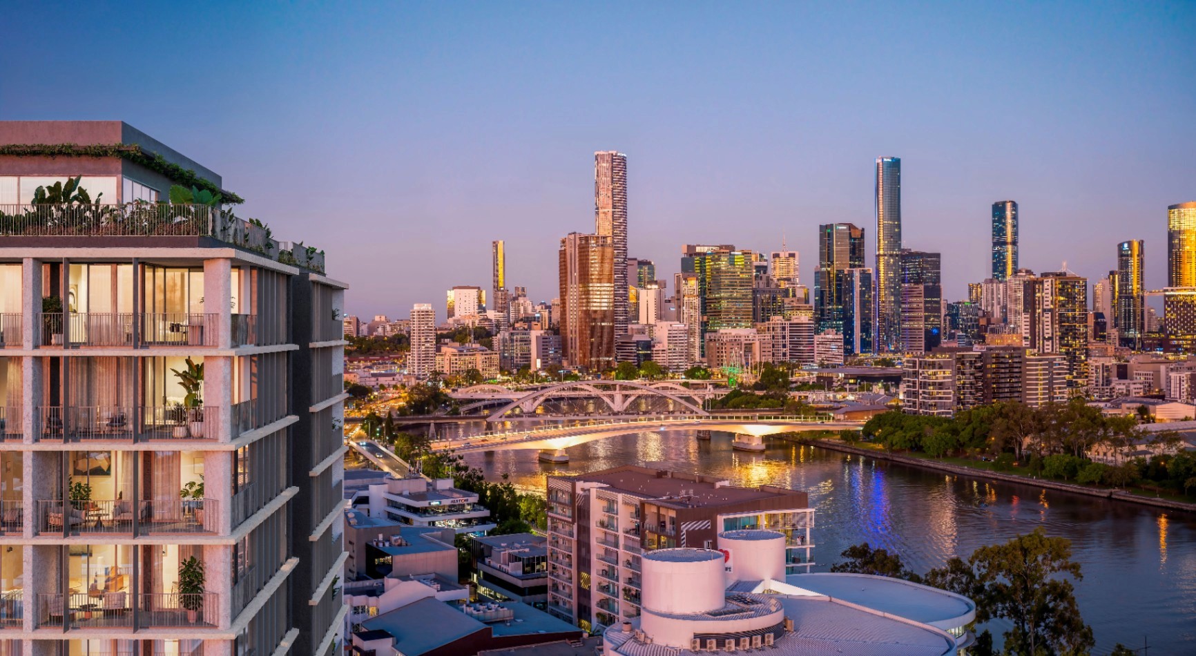 Modern apartment building at Quartet Milton overlooking Brisbane CBD skyline and river at sunset, luxury inner-city living Queensland