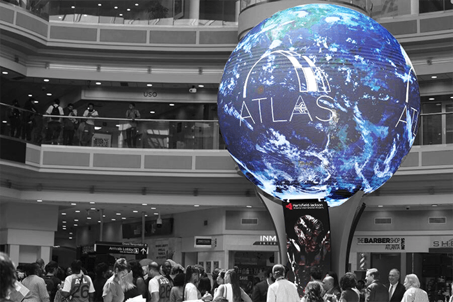 A photo of the ATLAS sphere at ATL, showing an image of the Earth with the word ATLAS over the top