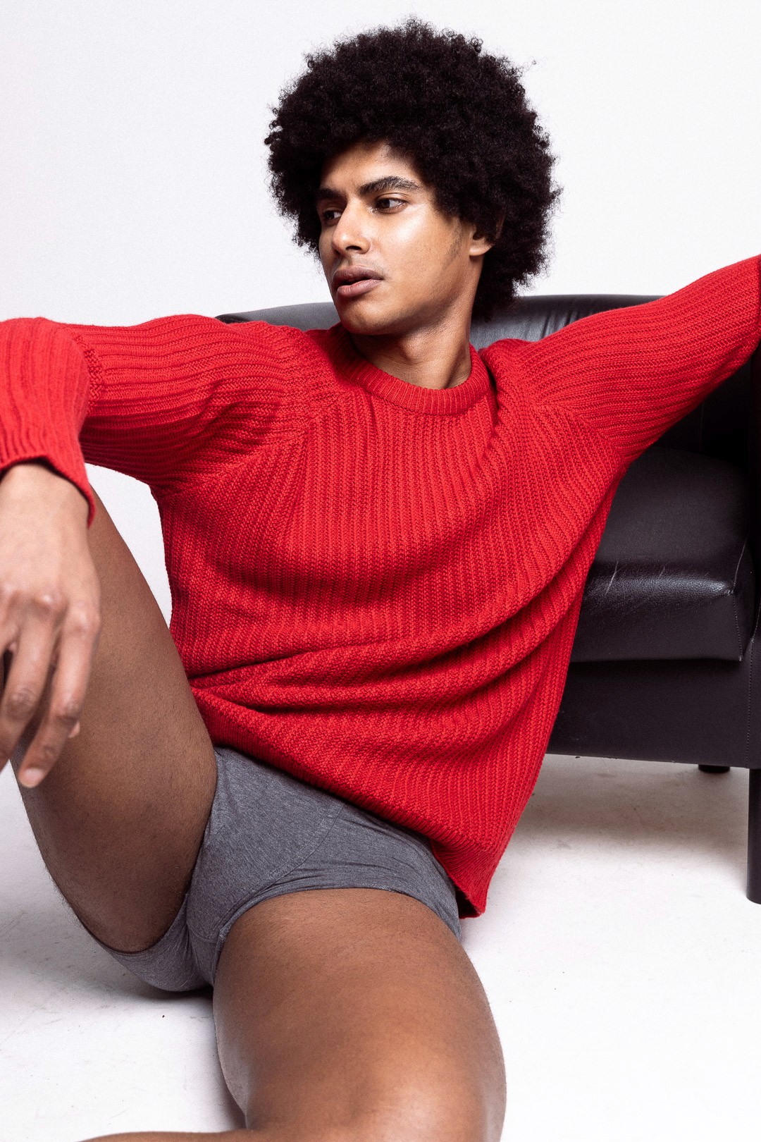 Man sitting on a skateboard