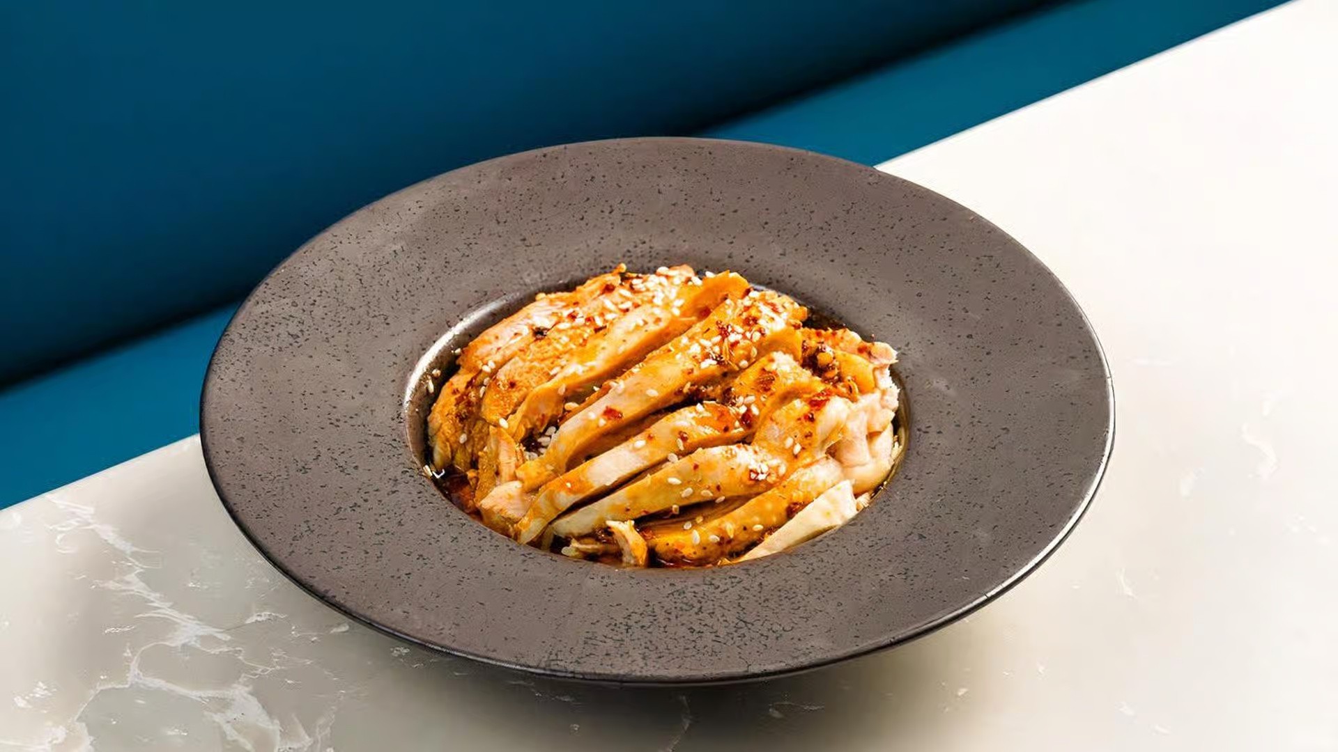 two glass of iced tea with some orange fruit around them