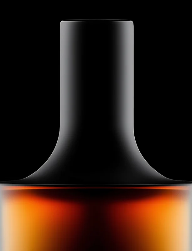 The Ember bottle, neck and shoulder lit from below