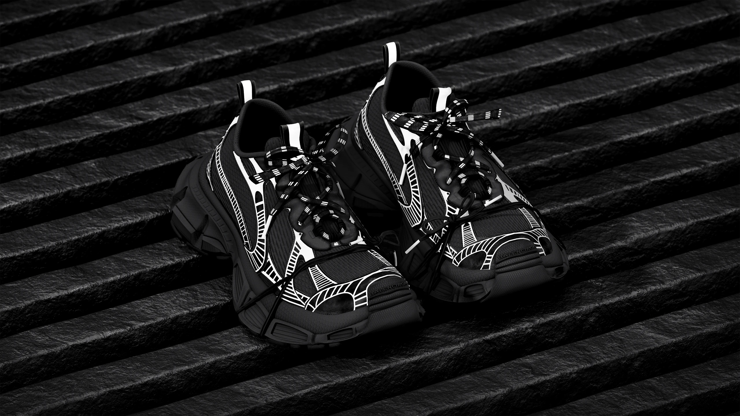 Balenciaga sneakers 3D render, black and white graphic print pair on dark stone steps, low-key lighting