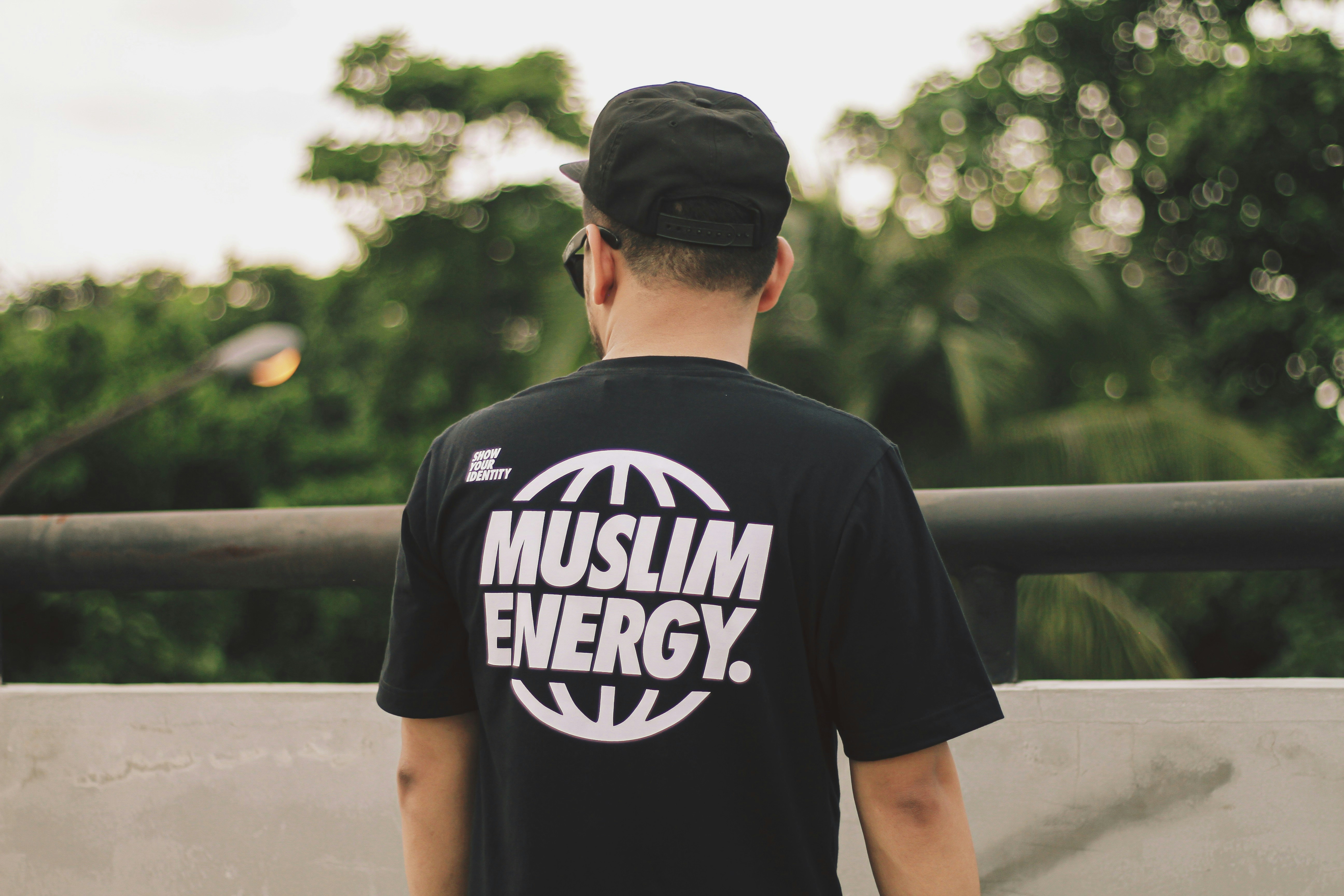 a man wearing a t - shirt that says muslim energy