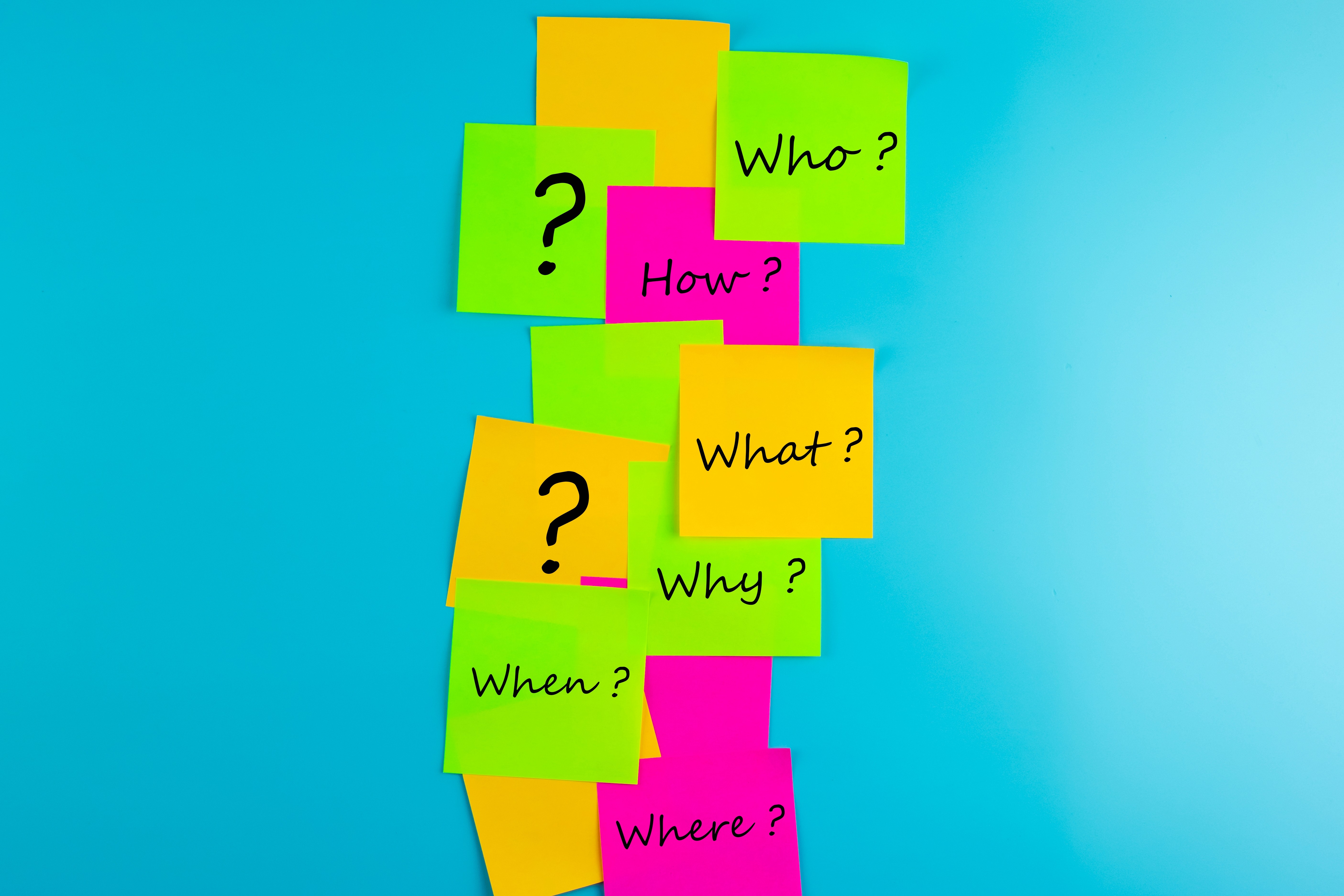 Colorful sticky notes with the questions Who How What Why When and Where arranged vertically on a blue background, representing the four idea sources that generate unlimited content topics for service business owners