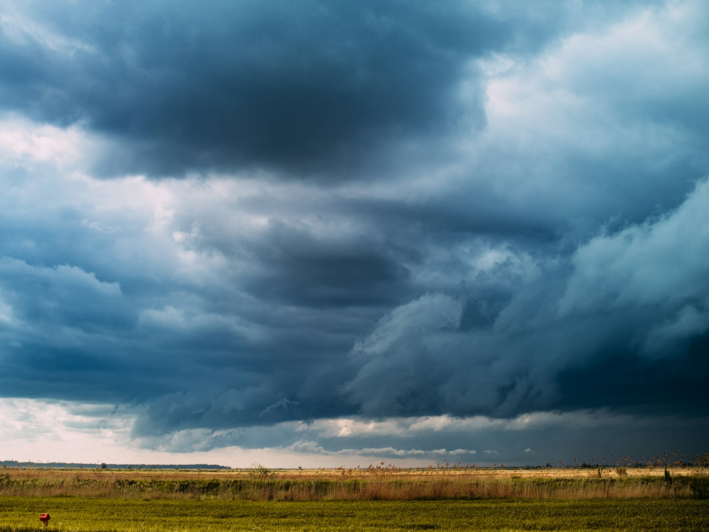 Storm clouds building over green season grassland in Namibia