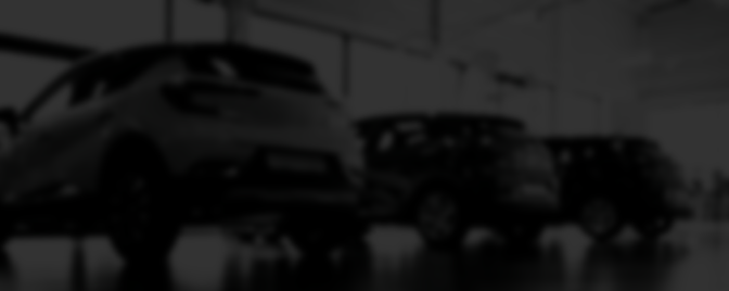 Vehicles lined up in a showroom.