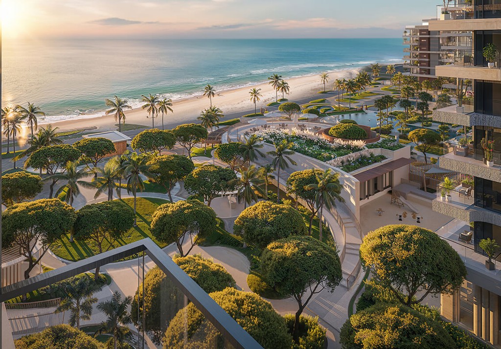 Oceanfront view from Ellington Sands showing landscaped gardens, palm trees, and beachside serenity.